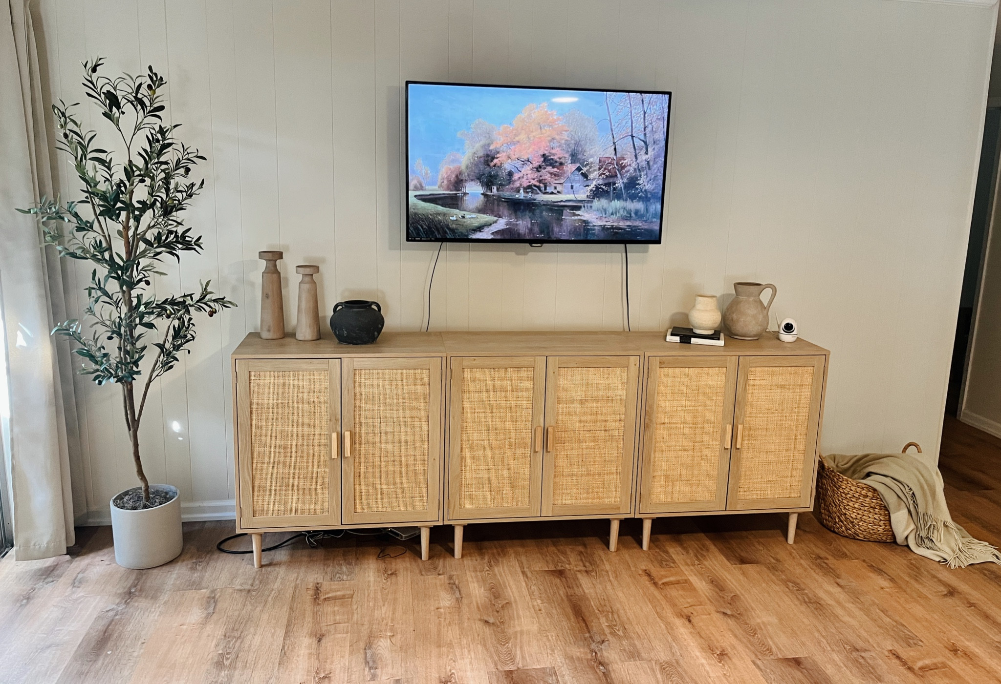 Loving my new entertainment set in my living room 🤍✨

Living room, furniture, house decor, cabinets, olive tree, basket 

#LTKfindsunder100 #LTKstyletip #LTKhome