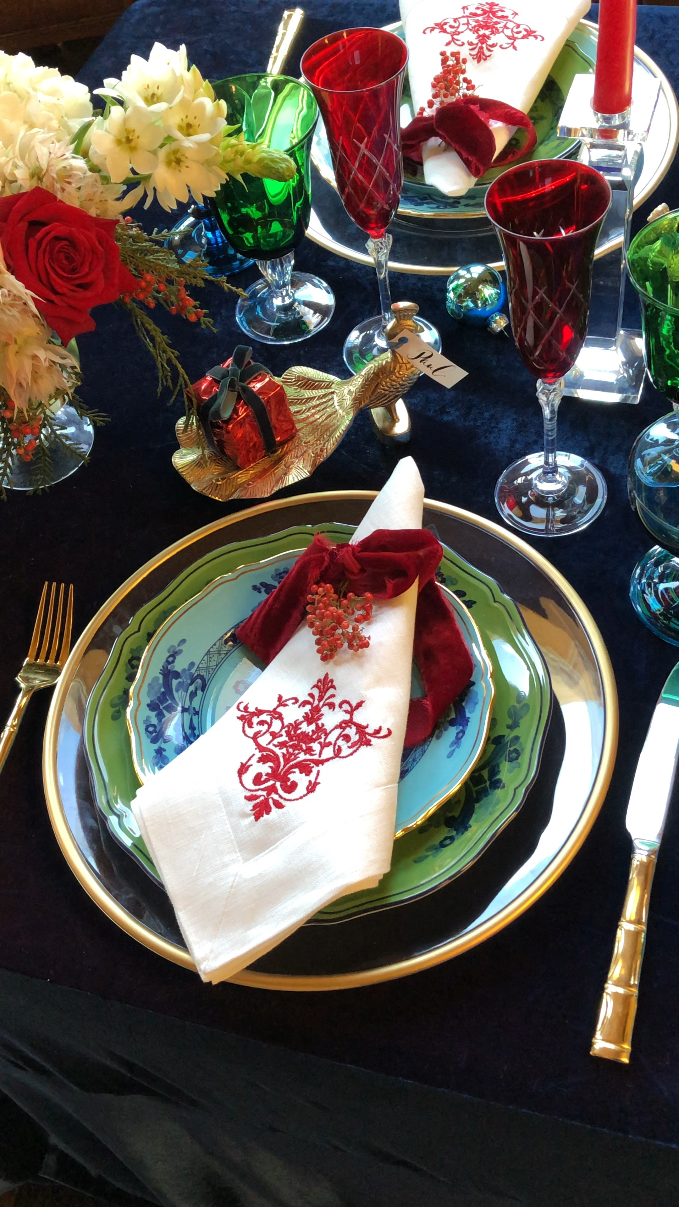 Celebrate Christmas with beautiful table and set with sophisticated jewel tones! Brightly colored plates, jewel colored stemware and a velvet tablecloth sets the scene! 
#christmastable #christmastablescape #Christmaspartydecor #christmasdecor

#LTKHoliday #LTKHome #LTKParties