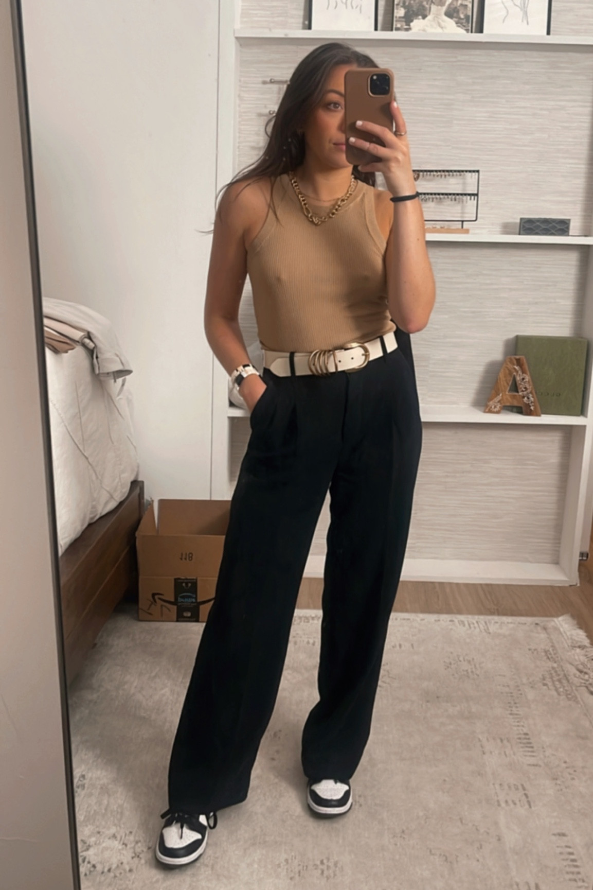 White belt, black trouser pants, tan tank top, Nike panda dunk low 

#LTKFind #LTKstyletip