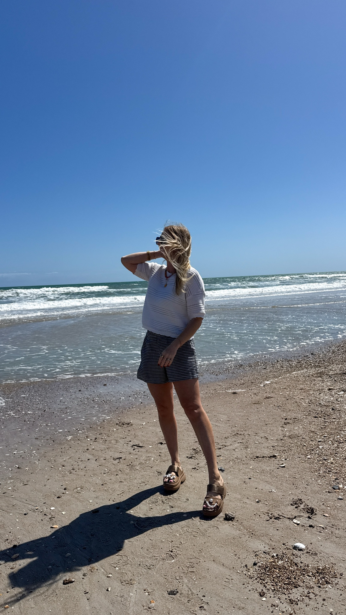 Beach outfit! These gingham shorts and open knit top are both on sale!! 

#LTKSaleAlert #LTKootd #LTKmomlife