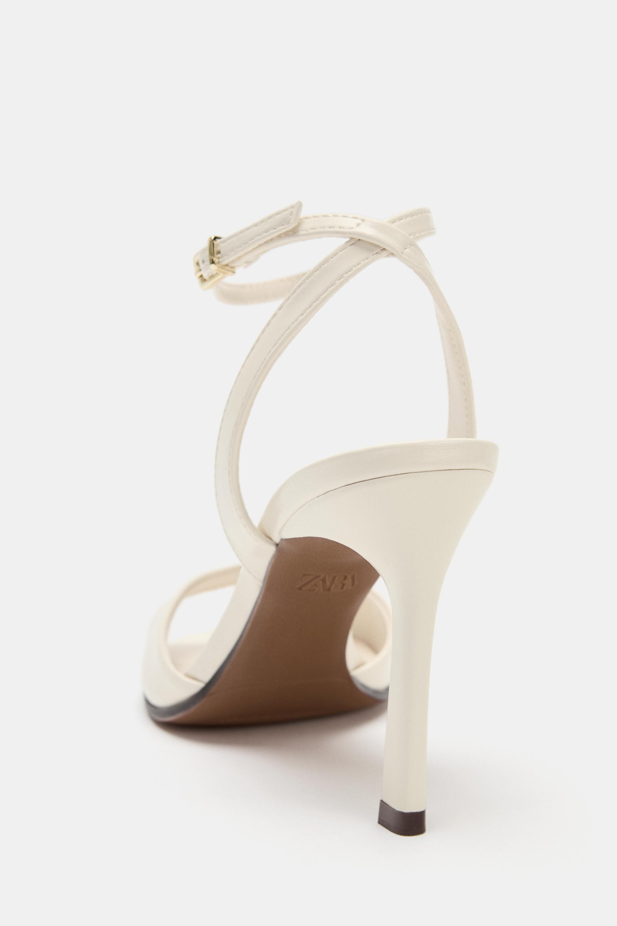 Heeled sandals. Front strap. Ankle strap with metallic buckle closure. High heel. Squared toe.Hee... | Zara US