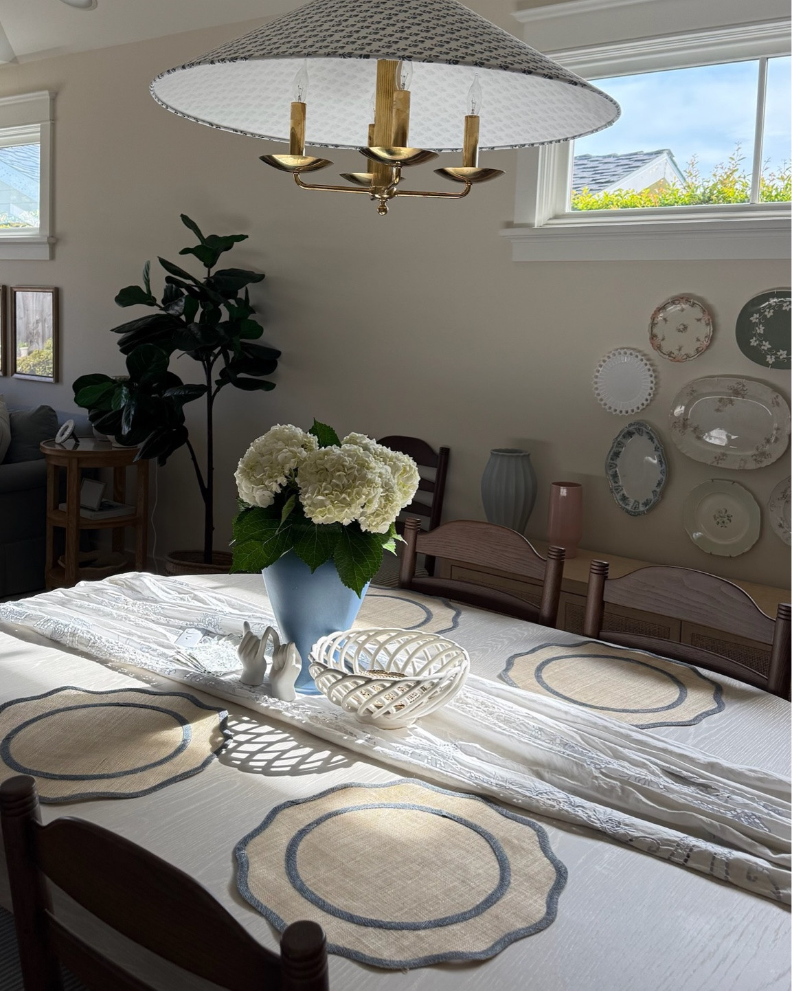 So excited to host dinner parties here!
Check out the full home makeover process on my YouTube channel!

coastal cottage aesthetic, coastal cottage decor, dining room decor, dining room makeover, home makeover, coastal home, cottage style home, coastal interior design, coastal dining room, beach house decor, dining room inspiration, dining table decor, coastal dining table, woven dining chairs, cane dining chairs, rattan dining chairs, wood dining table, buffet cabinet, rattan buffet, coastal sideboard, dining room sideboard, blue and white decor, blue and white table setting, coastal table linens, scalloped tablecloth, hydrangea centerpiece, floral centerpiece, blue vase decor, decorative wall plates, plate wall decor, coastal wall decor, white kitchen cabinets, glass display cabinets, coastal chandelier, woven pendant light, statement dining light, neutral home decor, cottagecore decor, timeless home decor

#LTKvlog #LTKdayinmylife #LTKHome