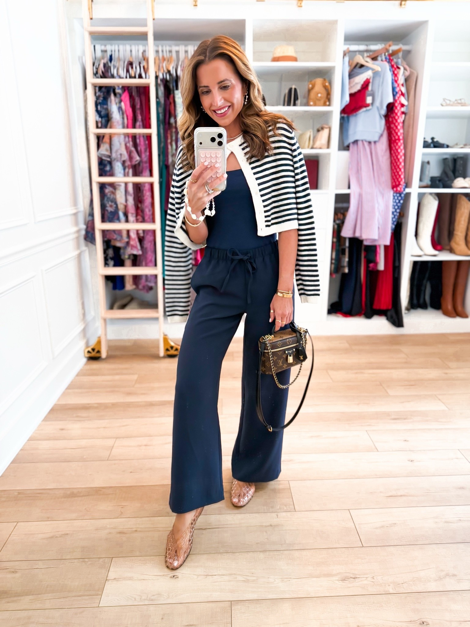 My summer outfit of the day! Elevated casual outfit. Mom outfit. Europe outfit. Business casual. Travel outfit. Aritzia wrinkle resistant wide leg pants in XS short. Aritzia striped cardigan in 2XS. Amazon cami in XS. Jelly ballet flats are whole sizes only - I sized down to a 6 per reviews and am usually a 6.5.

#LTKgrwm #LTKootd #LTKTravel