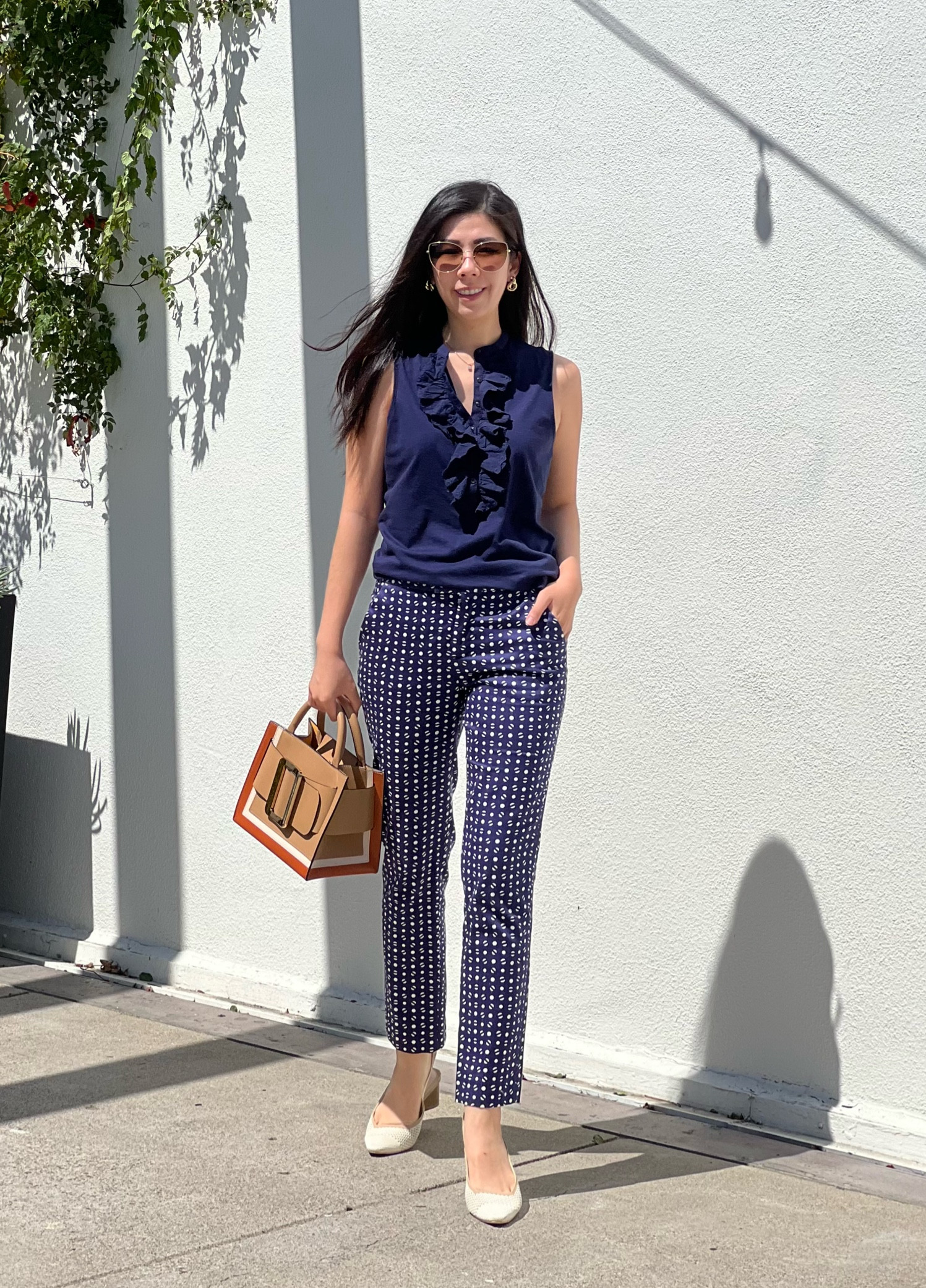 A blue business casual look for the day! Would you believe me if I told you that I bought these polka dot pants 11 years ago?! I’m surprised they still fit! I was into bold and very bright clothing back then! My current style resonates more with this soft spoken look! I paired these hot pants with my ruffled sleeveless top and neutral slingbacks. Of course, I didn’t want to be too serious so I wore my colorblock top handle satchel.

#LTKStyleTip #LTKWorkwear #LTKShoeCrush