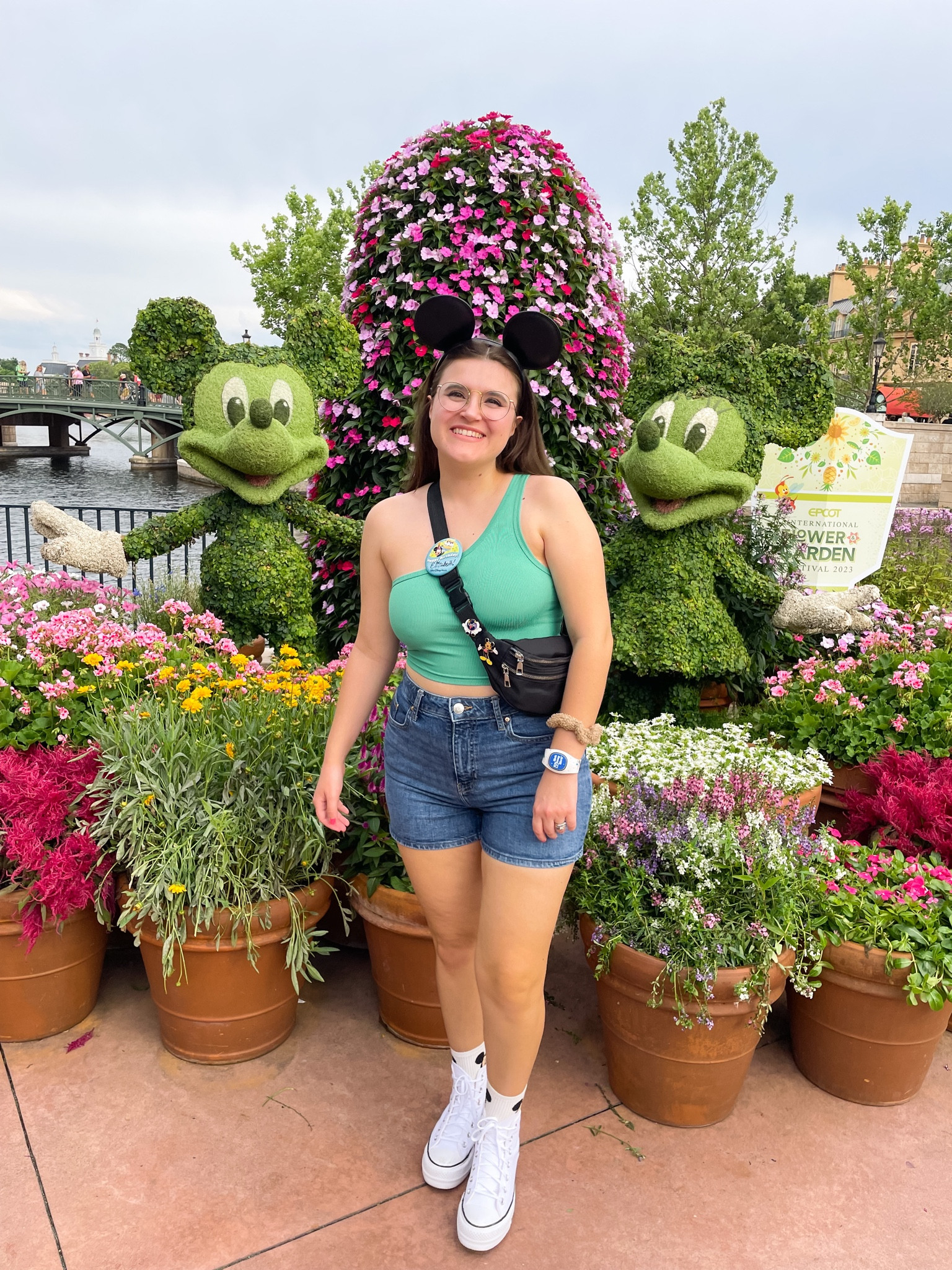Perfect casual flower & garden festival at Epcot outfit! This outfit is perfect for the Florida summer heat and walking around Epcot at Disney World. Paired with the black leather ears from shop Disney this outfit is simple, classic with a touch of Disney magic. Follow for more Disney outfits perfect for your next vacation.

#disneystyle #disneyoutfits #disneyworld #floridaoutfits #disneyvacation #disneytrip #disneyoutfitinspo #epcotoutfit
