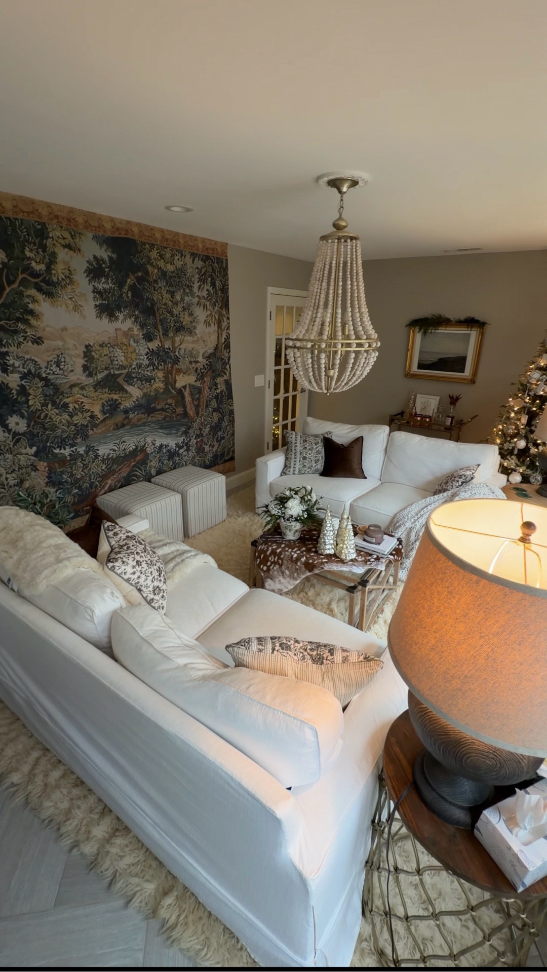 Renter-friendly tapestry wall + cozy living-room staples. Linking the sofas, tapestry, pillows, rug, and holiday accents from this space. #tapestrywall #europeaninspired #livingroomdecor #renterfriendlydecor #walltreatment #frenchtapestry

#LTKHome #LTKHoliday #LTKFindsUnder100