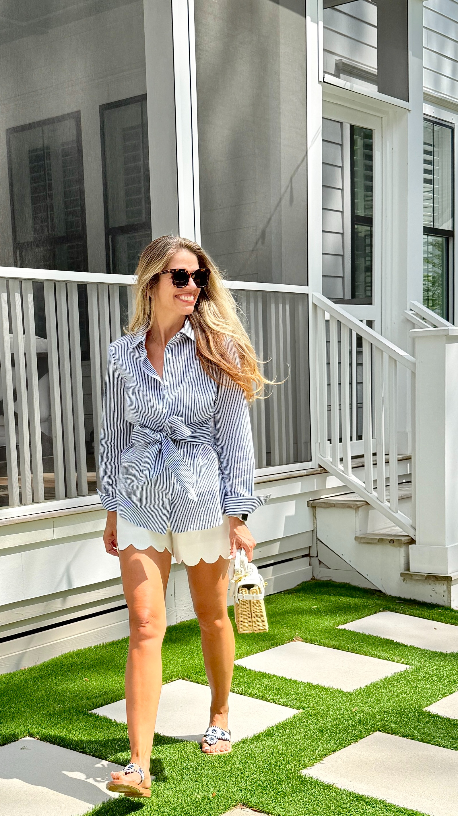 Spring striped Blouse from J. McLaughlin, Also comes in white, pink and black. Scalloped shorts, Palm Beach Sandal Co Seersucker leather sandals. Wicker purse. Spring style 

 #LTKMothersDay #LTKootd #LTKOver40