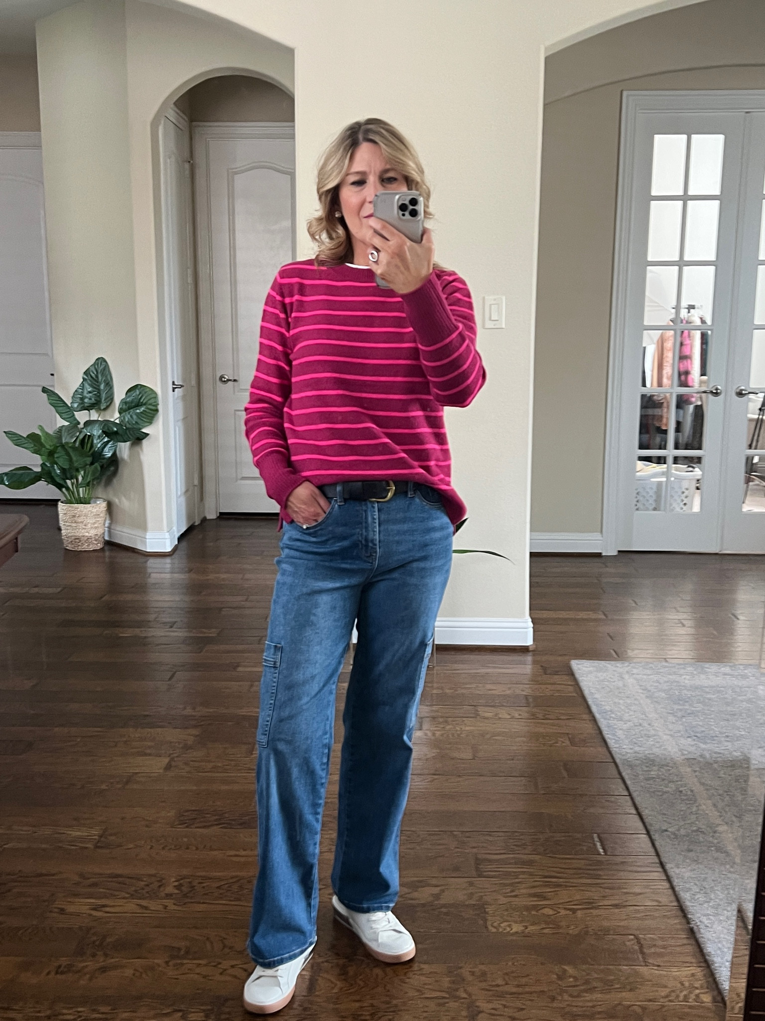 Striped sweater runs tts. Cargo jeans very stretchy. Run tts. Sneakers run tts. Snug fit at first, but will stretch a bit. 

#LTKover40 #LTKstyletip #LTKfindsunder100