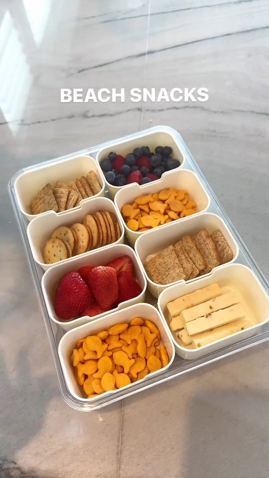 We love this portable snack box! Great for car rides, pool/beach, sports, etc! Love this one because it comes with a freezer pack underneath to keep items cold! 

#LTKKids #LTKmomlife #LTKTravel