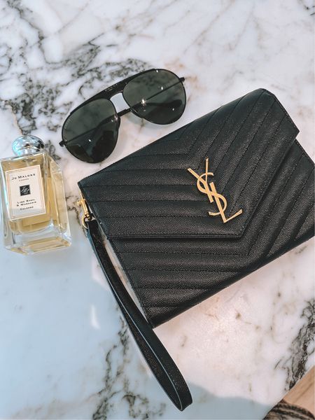Favorite scent, sunglasses, and classic clutch that fits everything you need! 🖤