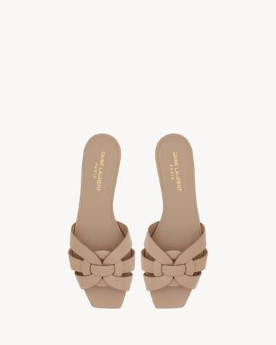 Slip-on flat mules with a square toe and intertwining straps. | Saint Laurent Inc. (Global)