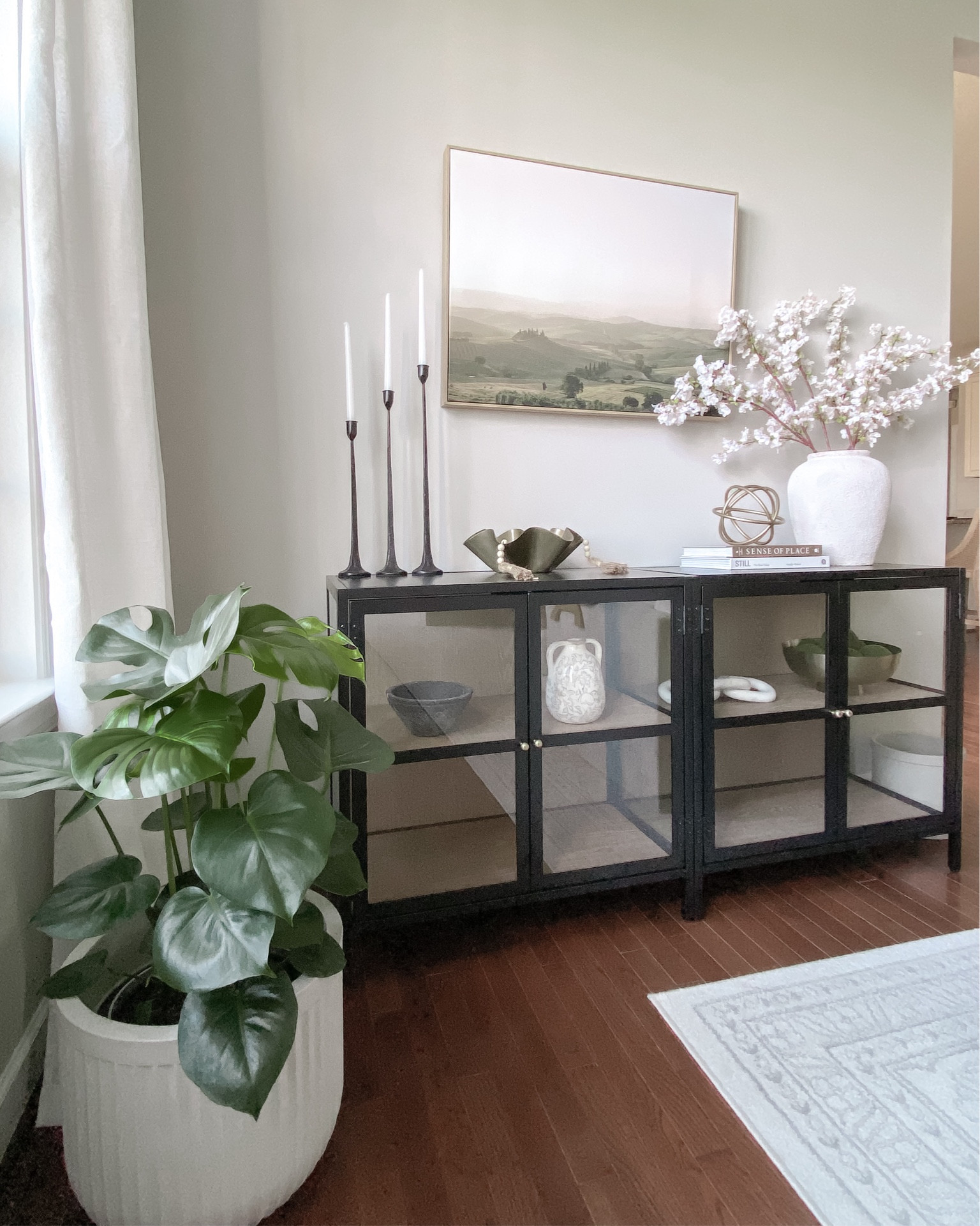 Spring home decor
Amazon cherry blossom stems - great quality.

Target black frame glass cabinet - I put two of them side-by-side!
#LTKhome