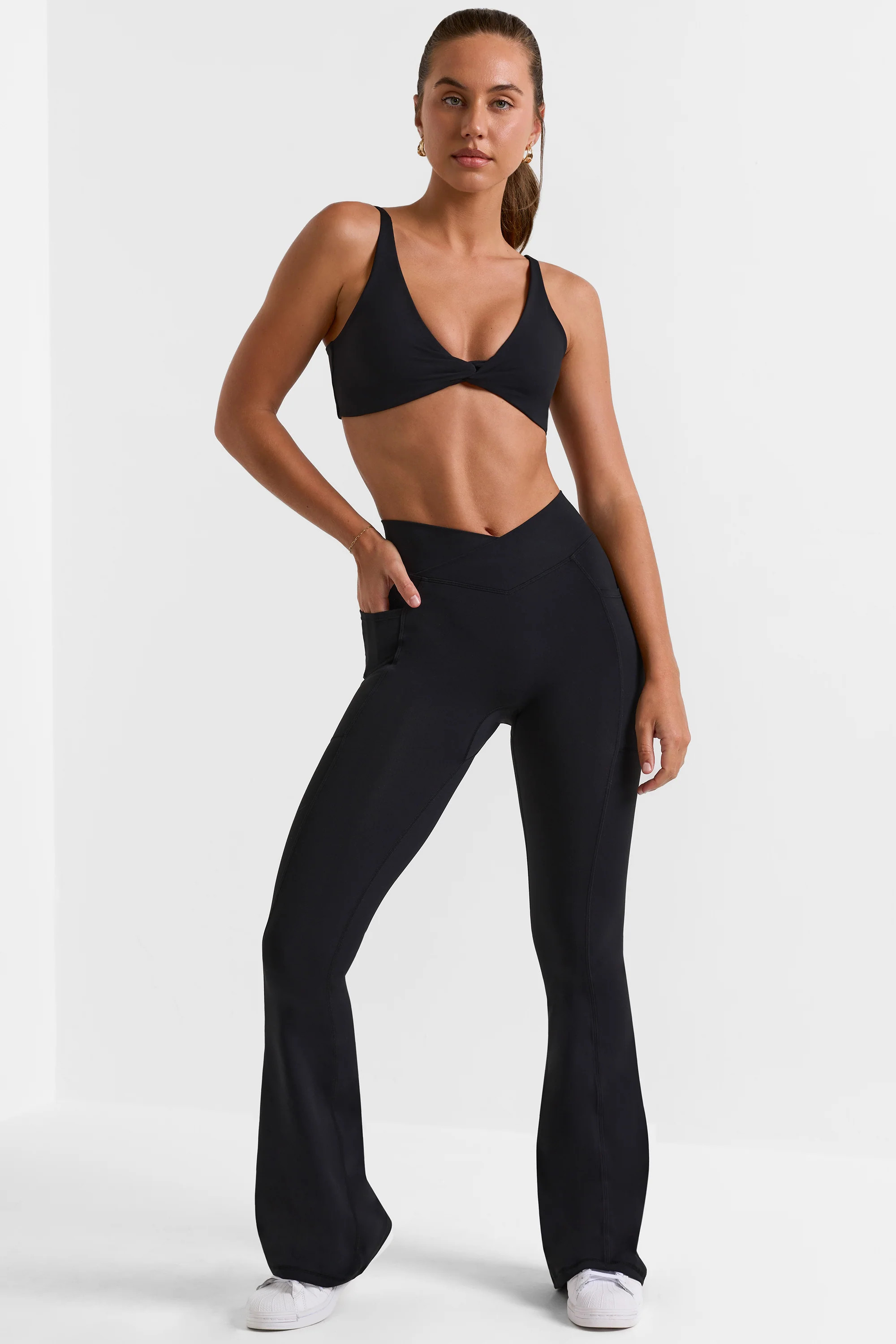 Soft Active Wrap Over Flared Leggings in Black | Oh Polly