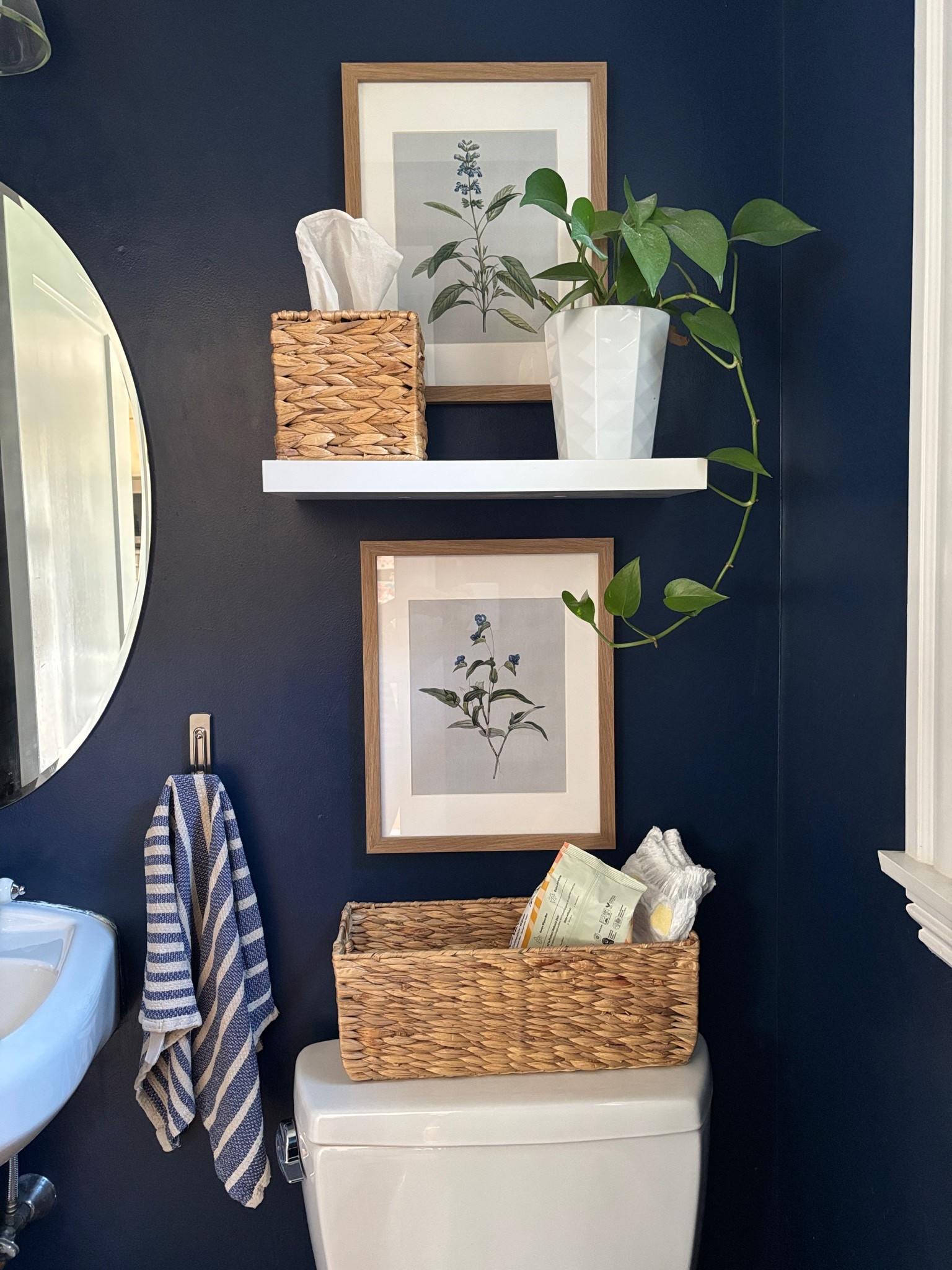 Fun and practical bathroom decor on a budget (bonus: it’s kid-friendly! Hello diaper and wipes storage!)