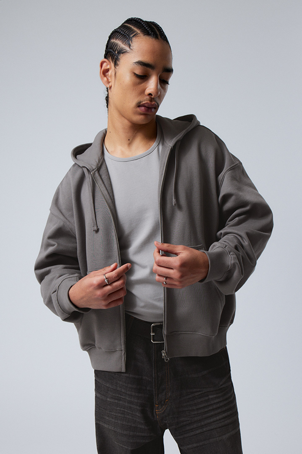 A boxy zip hoodie made from a soft cotton fleece jersey enhanced with recycled polyester. It has ... | Weekday