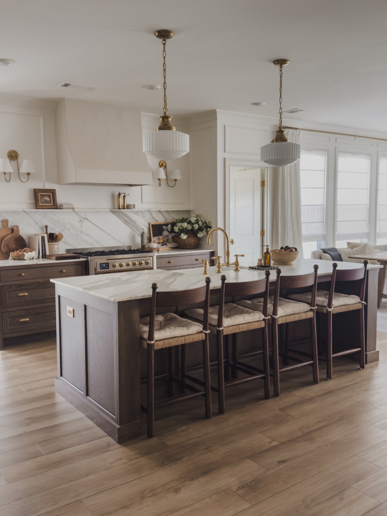 Classic, open concept kitchen with timeless details! From rich wood tones to unlacquered brass details — these features have been thoughtfully curated to make an impact for years to come.

Home finds, neutral home inspo, collected style, kitchen views, open concept living, rich wood tones, furniture favorites, counter stools, brass details, linen curtain, roman shades, breakfast nook, Home and Kids co, Arhaus, Visual Comfort, Pottery Barn style, Two Pages, McGee and Co, Rejuvenation, Wayfair, shop the look!

#LTKHome #LTKSeasonal