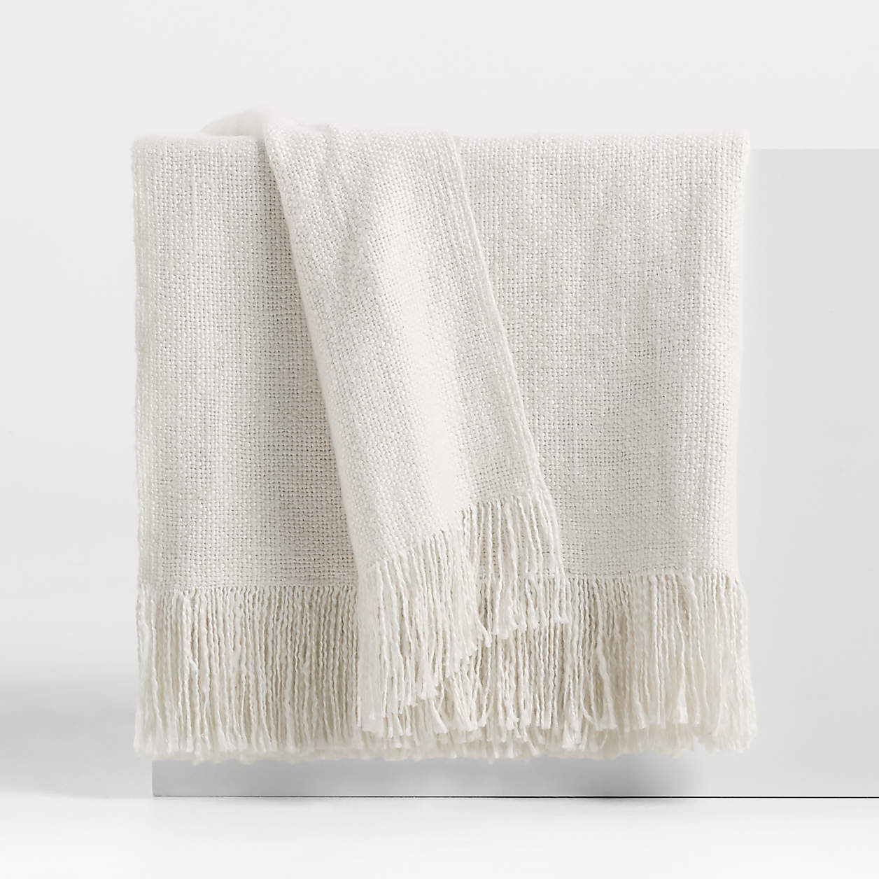 Casual Textured Fringe 70"x55" Arctic Ivory Throw Blanket + Reviews | Crate & Barrel | Crate & Barrel