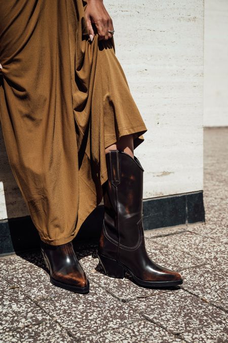 Mid length brown distressed western boot for festival season  Smooth, sleek leather with minimal distressed detail and a angled block heel give this style that familiar cowboy boot silhouette.

#LTKSeasonal #LTKshoecrush #LTKFestival