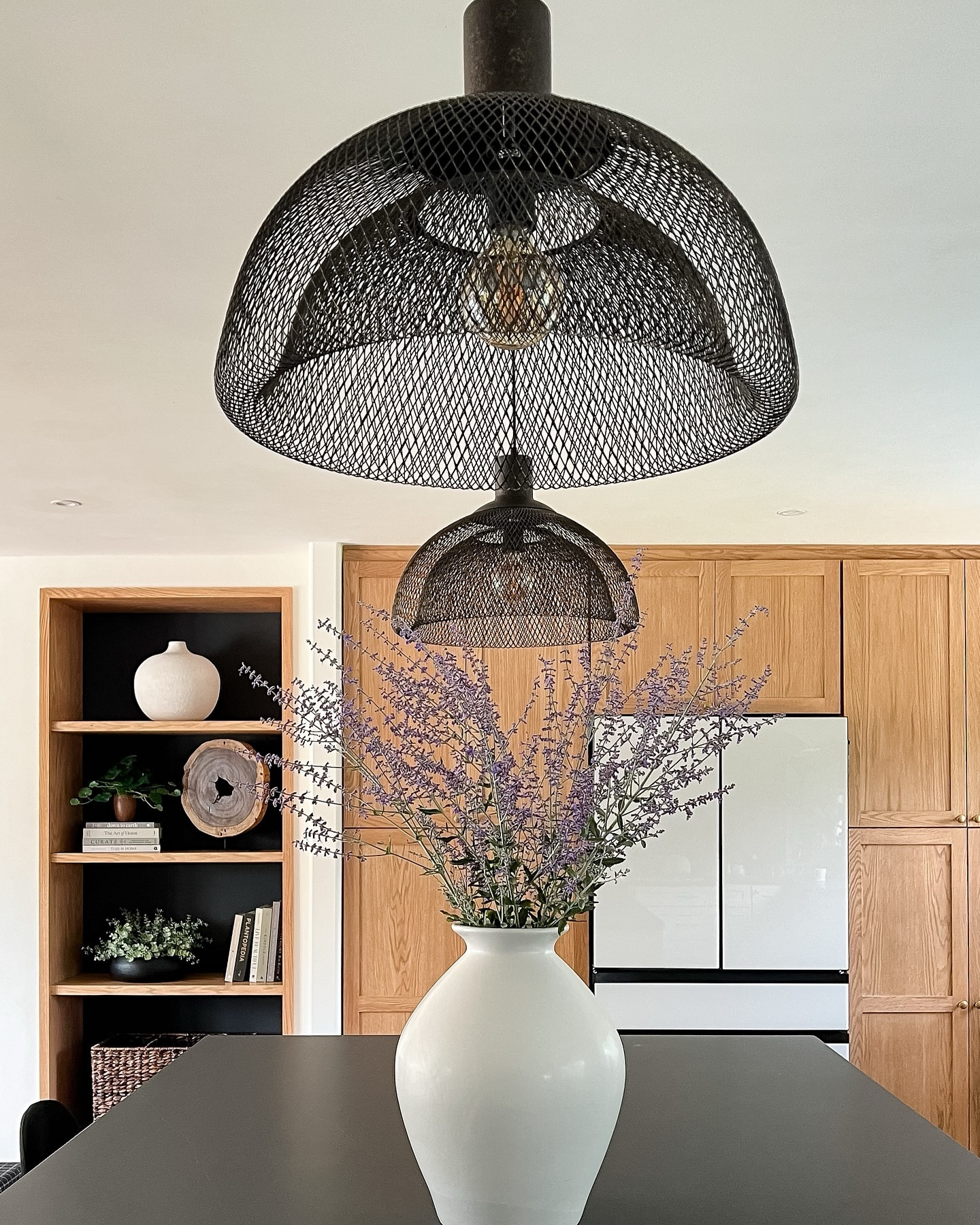 New pendant lights and painted the back of our built-in!
.
The dark elements just feel more like my home. 🖤
.
.
#diyhome #openconcept #kitchenlighting #livingroom #builtins #moderndesign