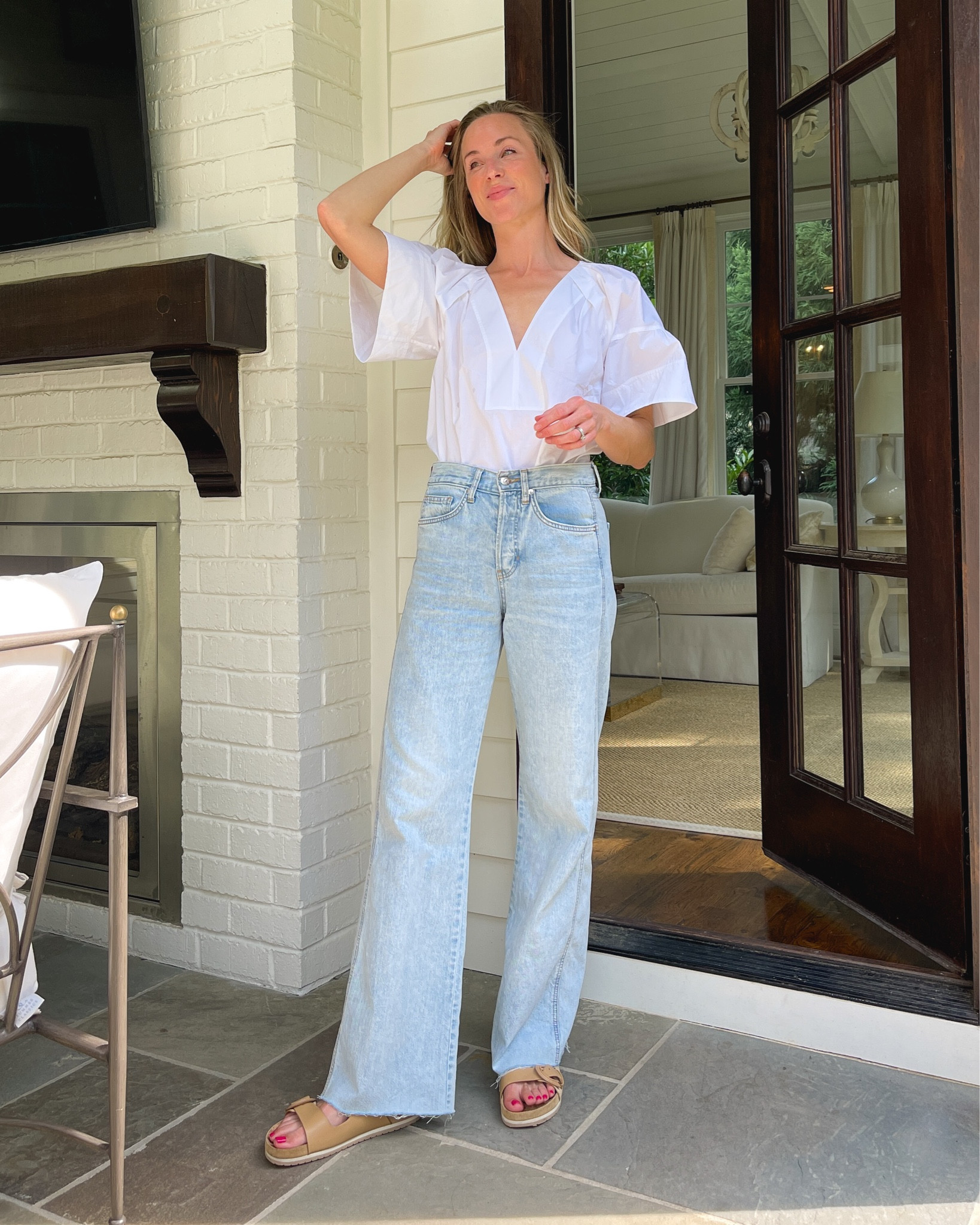 This cotton poplin tunic blouse by ALC is perfectly airy for summer (wearing size 2)! Jeans are incredibly flattering and dress up with ease (size down if between sizes). Vince sandals are old, similar linked.

#whiteblouse #whitesummertop #widelegjeans 

#LTKstyletip #LTKFind #LTKSeasonal