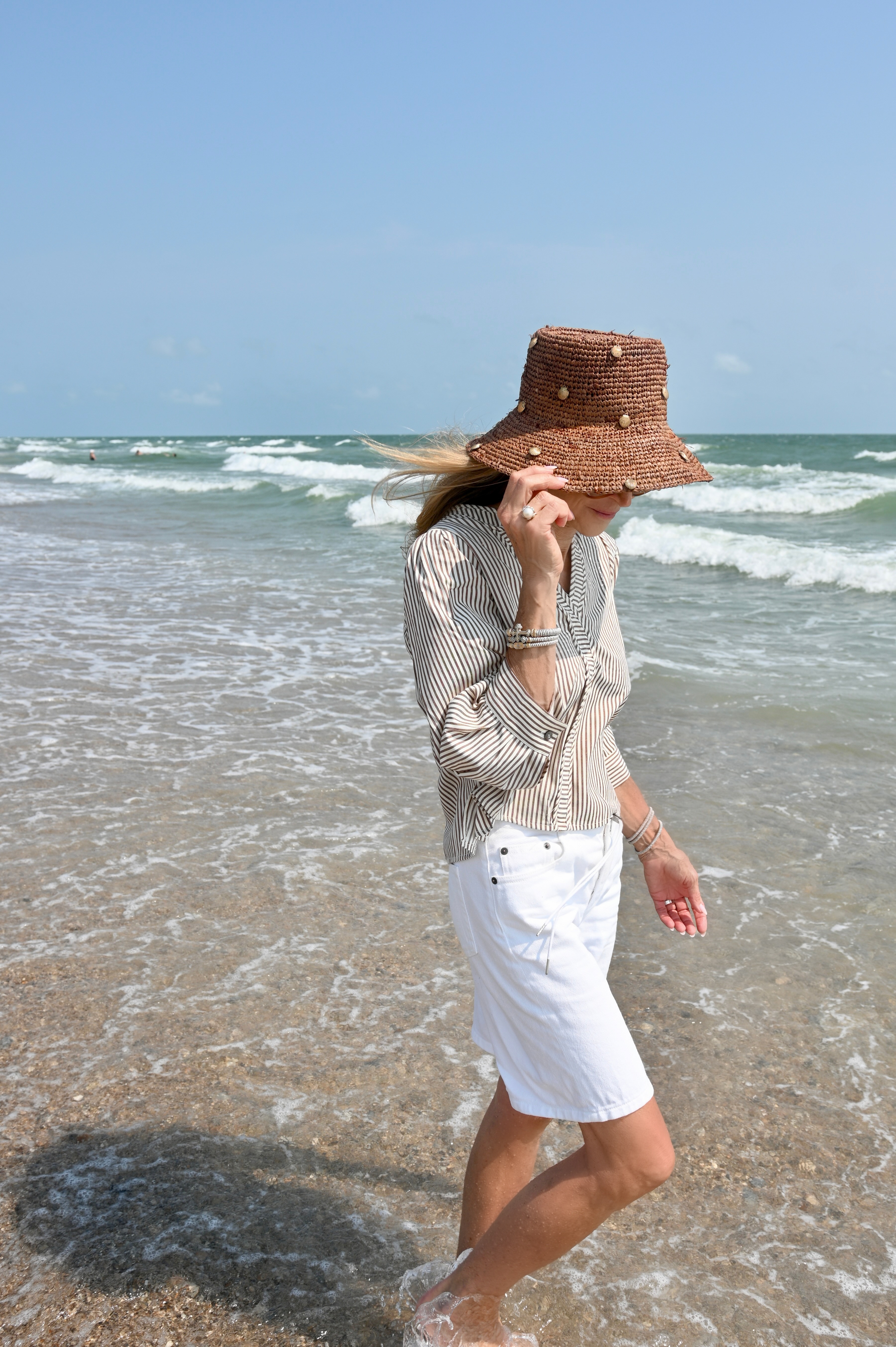 Looking like a coastal grandmother in this fabulous outfit!  A brown and white striped top paired with white denim Bermuda shorts and a hat make the perfect beachy look. 

 #LTKdayinmylife #LTKootd #LTKSeasonal