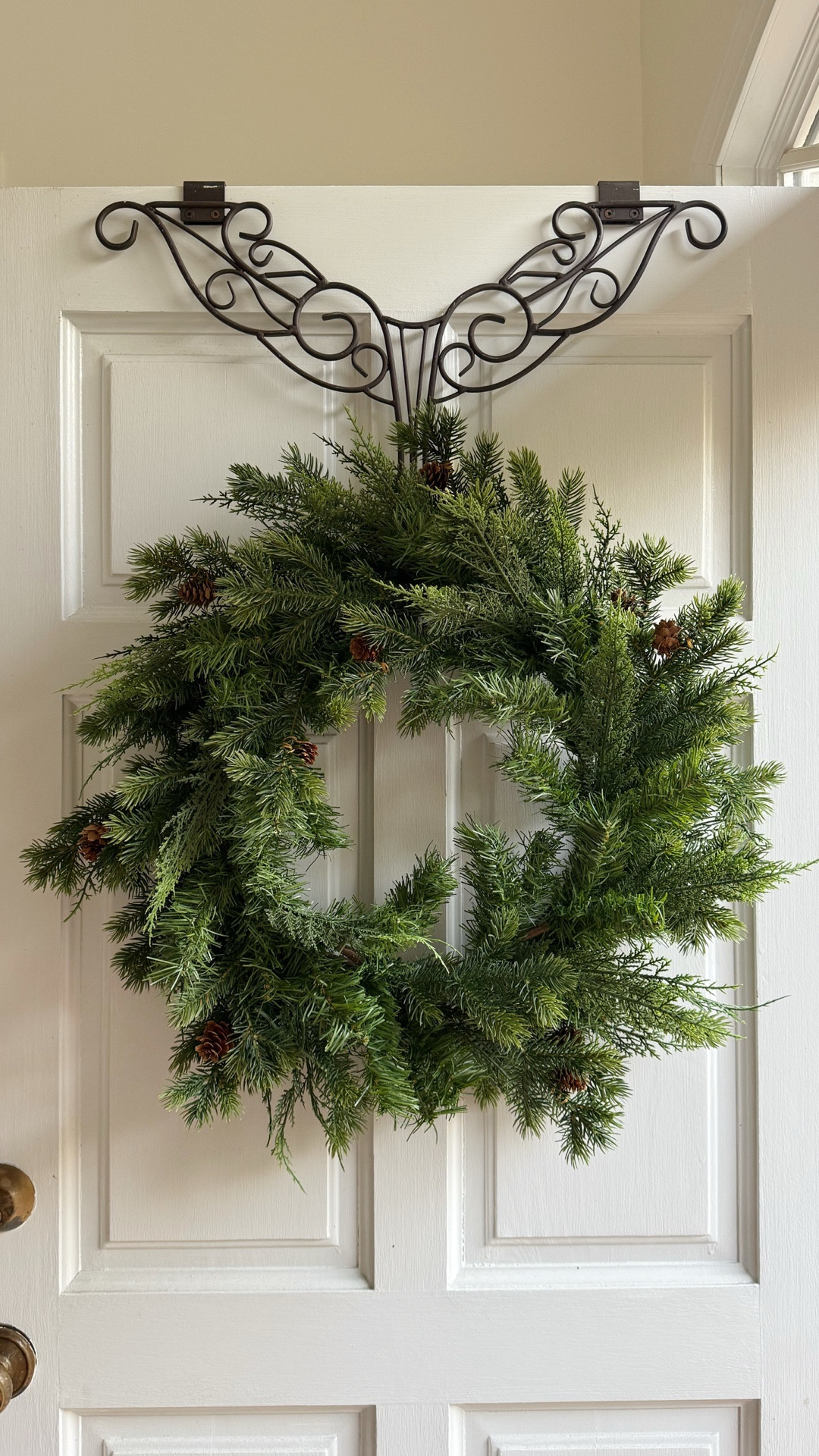 This wreath hanger from Amazon comes in 4 colors and is adjustable for this longer wreaths.  It’s also padded on the back so it won’t scratch the door.  

#LTKFindsUnder50 #LTKHome #LTKHoliday