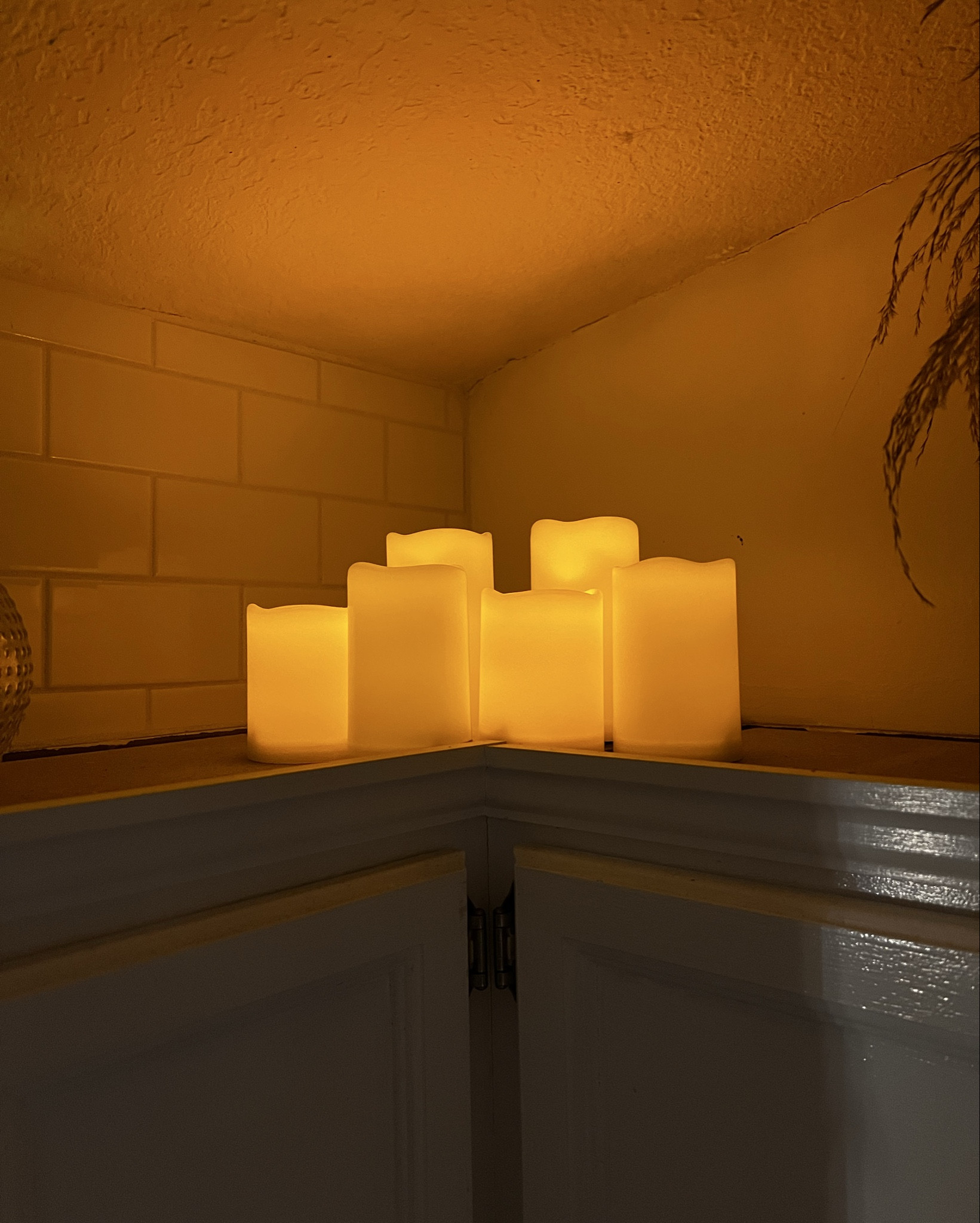 I’ve timed these LED twinkle candles to come on early in the morning so that when I come out to make my coffee they create a cozy glow on top of the kitchen cabinets.

#LTKHome #LTKdayinmylife