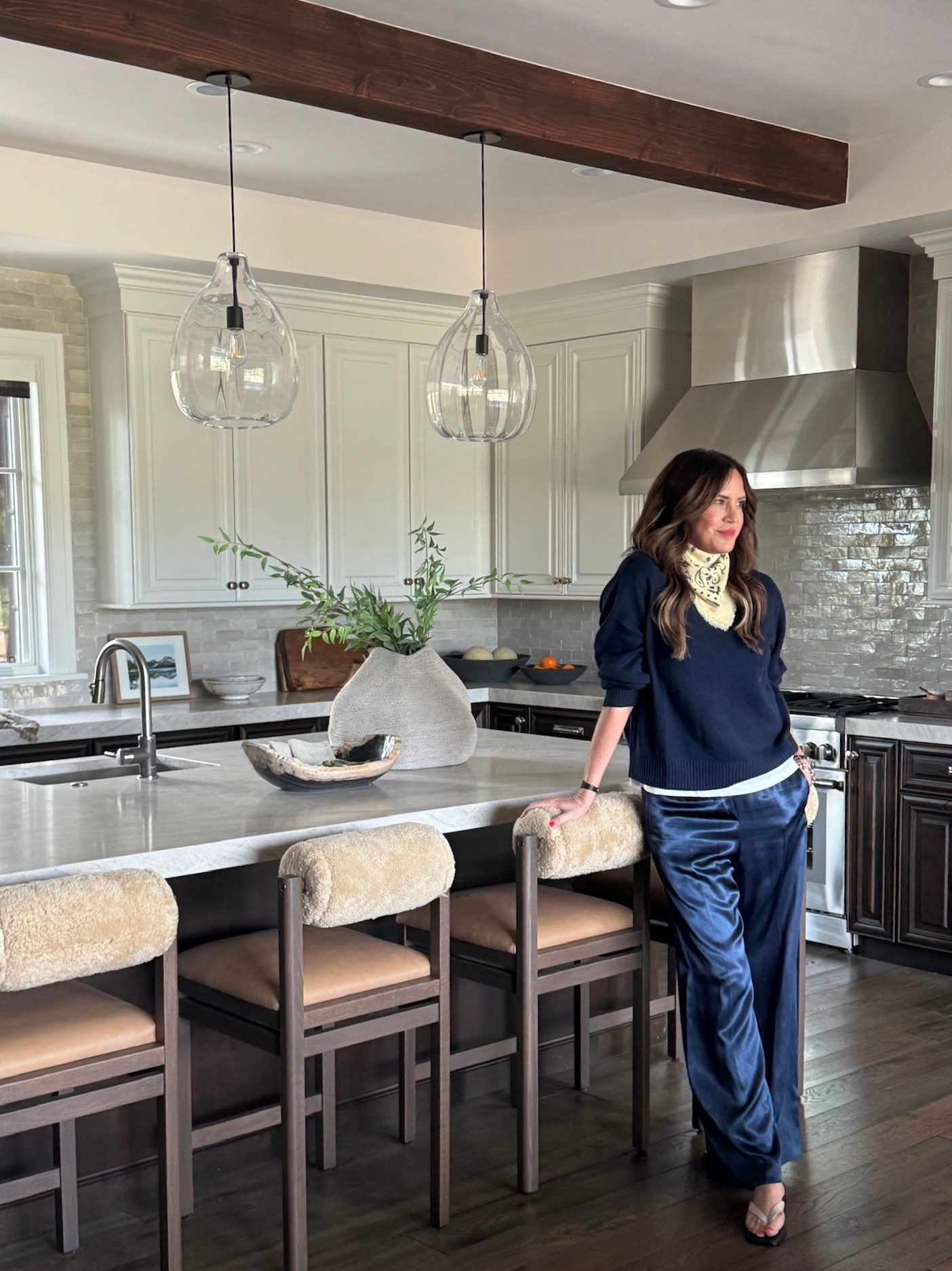 A quick snapshot of my fit during our client install yesterday! This will be my go-to spring uniform: satin pants, a light sweater layered with an elevated, basic tee underneath, chic flip flops, and a bandana tied in a fun way.

#LTKootd #LTKmomlife #LTKMothersDay