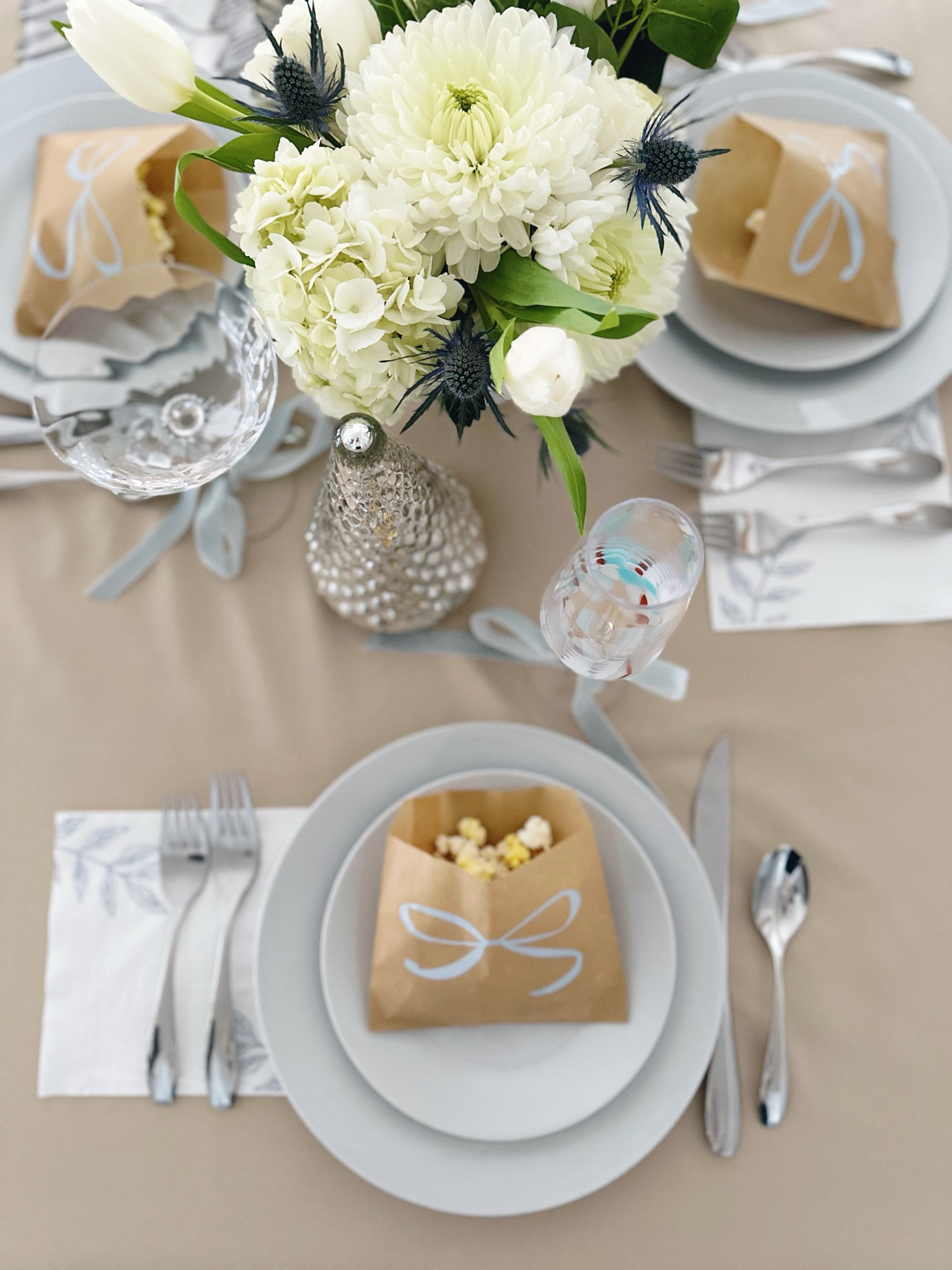 Throughout the tablescape for the brunch I had little nods to the theme of “tying the knot”. I added grease proof wax bags filled with gourmet popcorn to each place setting to symbolize “He popped the question now she’s tying the knot.” I then used my Cricut Joy to add a bow to each of the bags. The bags were a perfect addition to my color palette and the popcorn served as a small appetizer while guests visited with each other prior to eating brunch. 

wedding shower, wedding engagement party, baby shower, winter weddingg

#LTKwedding #LTKparties #LTKhome