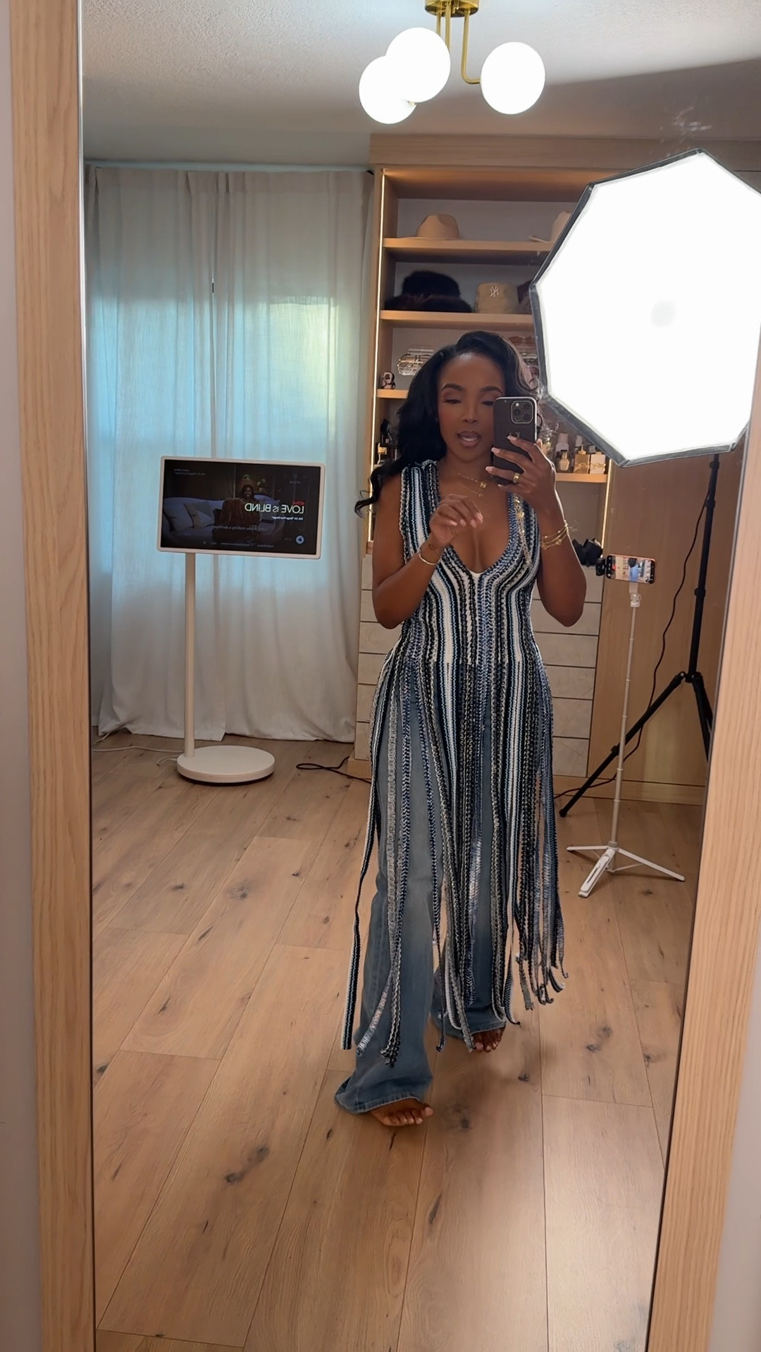 Layered, textured, and effortlessly cool 🖤 This striped crochet duster instantly transforms a simple denim base into a full outfit moment. The vertical pattern and long fringe detailing create movement and dimension, making it the perfect statement layer. Styled over relaxed wide leg jeans here, but this is the kind of piece you can restyle endlessly — which means the cost per wear keeps dropping.

Throw it over a fitted tank, a bodysuit, or even swimwear for vacation layering. Add heels for date night outfits or keep it casual with flats for daytime plans.

Perfect for: vacation outfits, brunch dates, casual dinner, beach cover-up styling, music festivals, girls’ night, or elevated everyday looks.

Tap to get details and favorite to recreate later.

📏 Sizing:
Wearing size Small  
Height 5’4” · 140 lbs · 36D · 27” waist · 40” hips

This post includes crochet duster styling, boho chic outfits, striped knit layering piece, wide leg jeans outfit inspiration, vacation layering looks, festival outfit ideas, statement layering pieces, and capsule wardrobe items styled multiple ways.

Follow me on Instagram and YouTube @kirasfashionfinds @AKIRA 