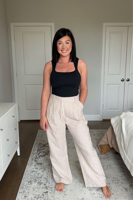 Obsessed with this look for spring and summer. The pants are everything. I have these in white, and this color feels thicker and fully lined so not see through. Wearing a med regular. The top is cropped but tucks into high rise pants. Wearing a med and it’s a thick material. All 15% off 

#LTKsalealert #LTKSeasonal #LTKstyletip
