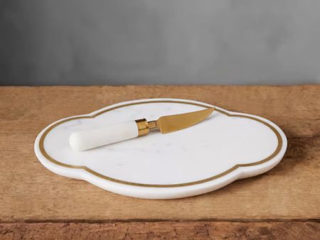 Arhaus Memorial Day sale ends tomorrow. This large cheese board is crafted from the natural mantle, brass and stainless steel. If you are a charcuterie liver, you will love to have it in Fuchs a great deal—- under $50 with knife. 

#LTKSaleAlert #LTKHome #LTKSeasonal