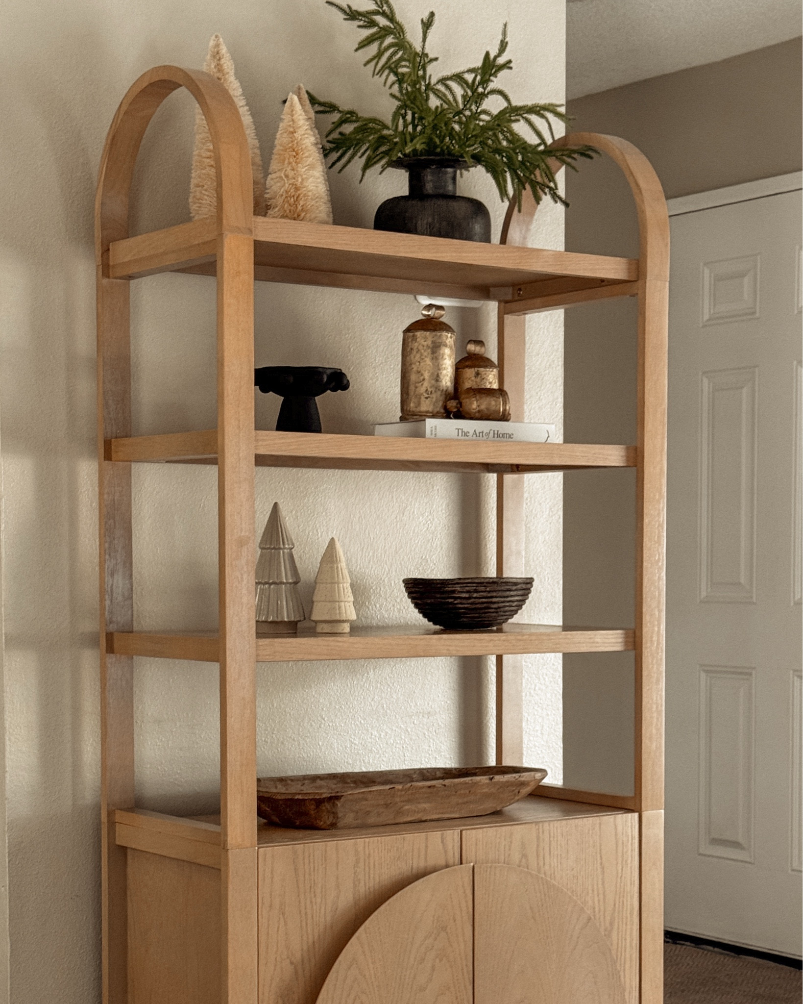 Today I added a touch of the holidays to my Iris Bookshelf from Nathan James.
l absolutely love the versatility this piece adds to my home! It comes in various gorgeous color options - I ordered the Raw Oak. So gorgeous and perfect for just about any space! You can use 1 bookcase for small spaces or put multiple together for larger rooms!

#LTKHoliday #LTKHome #LTKSeasonal