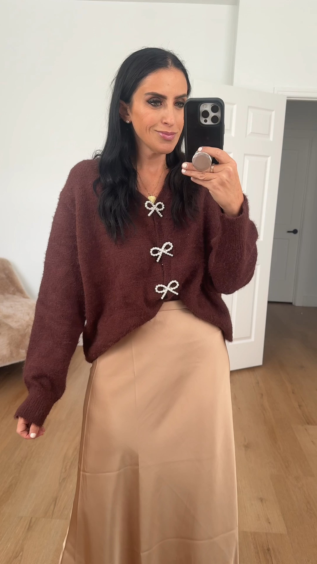Satin Skirt Flowy A Line wearing size medium. Long Sleeve Knit Cardigan Bow Buttons wearing size small.