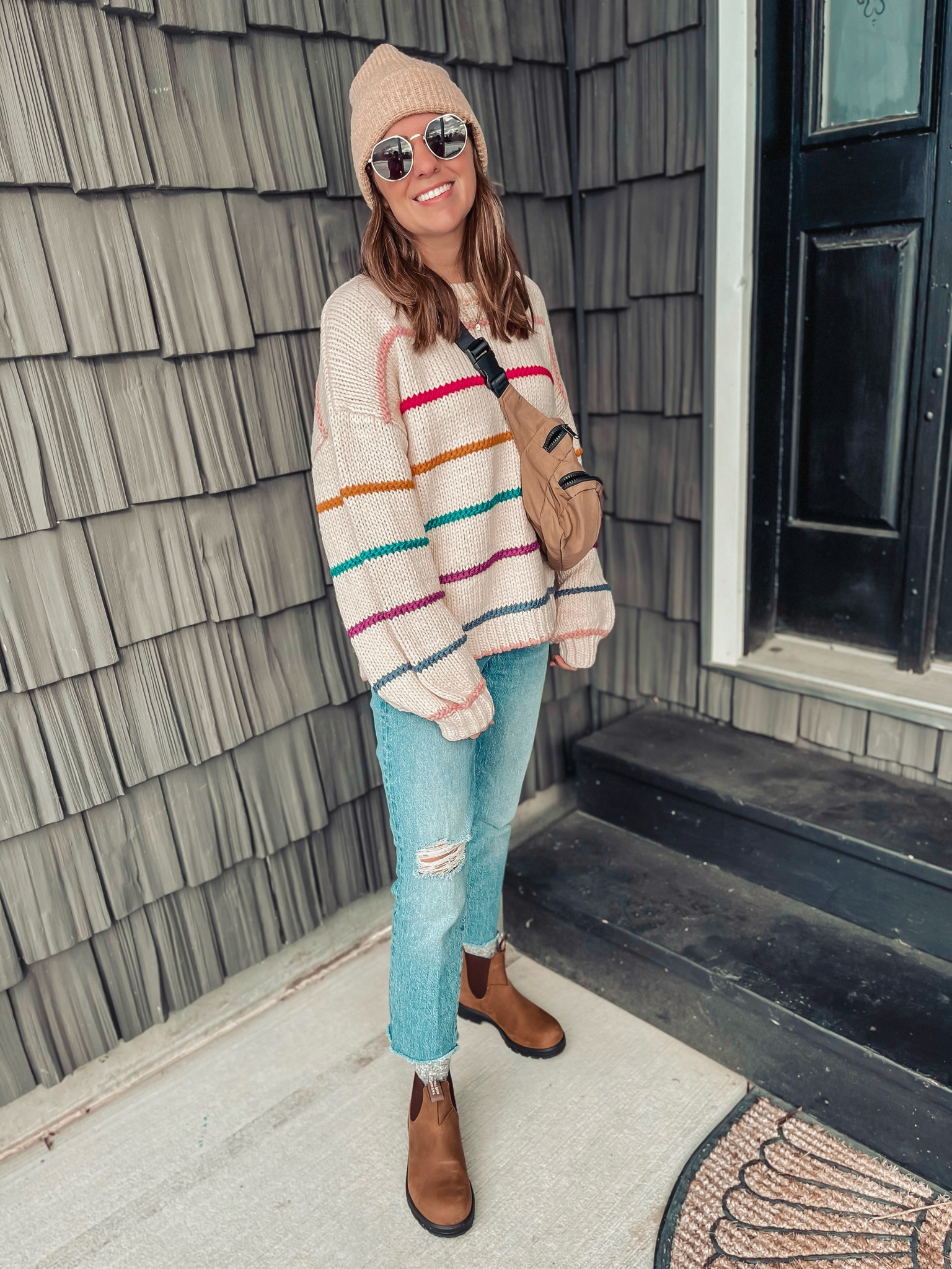 My sweater is from NY & Company and called the Dreamers Long Sleeve Multi Stripe Chunky Sweater - Brands We Love.
I also linked some similar sweaters! 
 My jeans are from madewell last year and sold out in this wash. I linked this year’s washes in the same style (perfect vintage straight jean). 

Stay true to size if you want a looser fit and go down one for a more true to size fit. The most comfortable jeans I’ve ever worn!

My blubdstones fit perfectly and 1/2 size up and they’re saddle brown color. Belt bag is sold out in this color but linked in other colors. 

#LTKfindsunder50 #LTKfindsunder100 #LTKstyletip