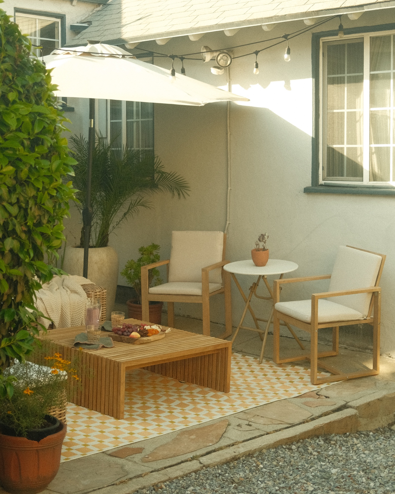 happy patio season ✨  my patio picks from @allmodern - a pop of color with this geometric outdoor rug, a pretty pair of solid acacia wood chairs, a teak coffee table made to stand up to the elements, and a corten steel planter box (with drainage holes!) 🌱 #allmodernpartner #modernmadesimple 

#LTKSeasonal #LTKHome