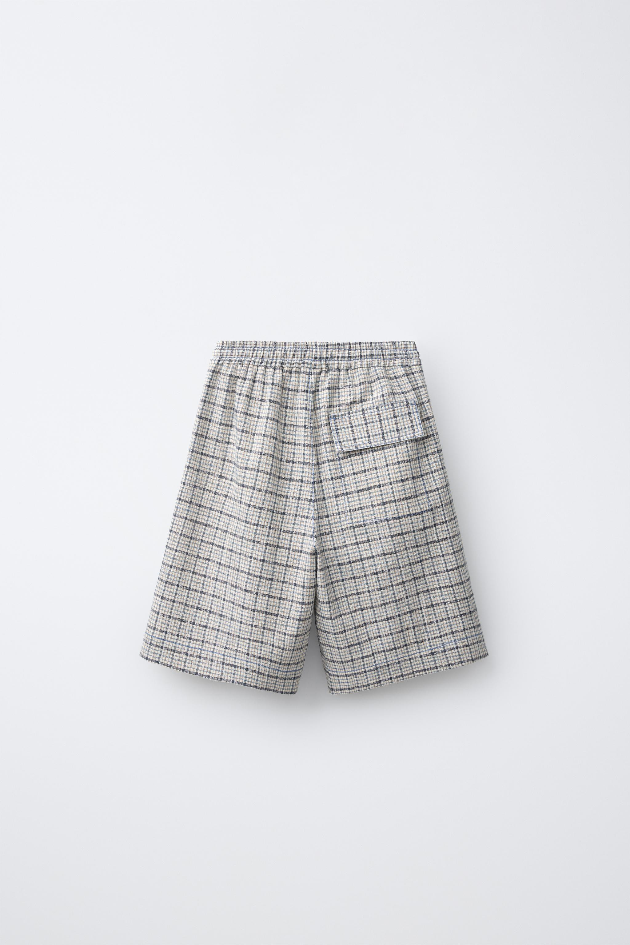 Shorts with elastic waistband and adjustable front drawstrings. Front pockets with contrasting to... | Zara US