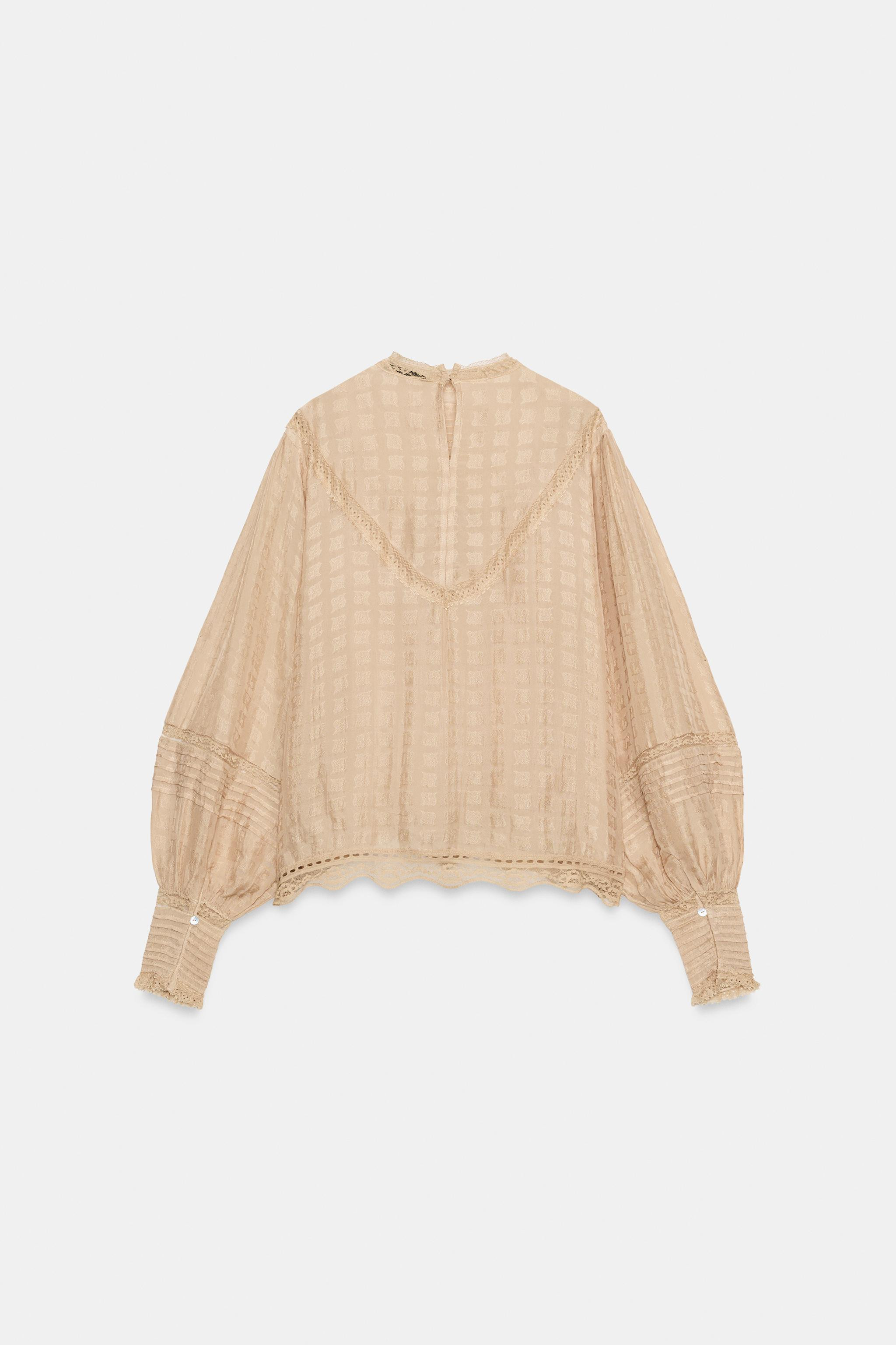 ZARA WOMAN COLLECTION. Shirt made of viscose fabric. Features a high neck and long sleeves with c... | Zara US