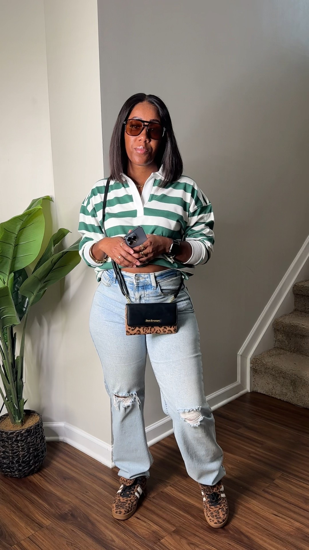 Long sleeve green and white stripe rugby shirt with high waisted light washed distressed jeans. I styled this fall outfit with a leopard print crossbody purse, leopard print sneakers, and brown sunglasses 

#LTKFindsUnder50 #LTKShoeCrush #LTKStyleTip