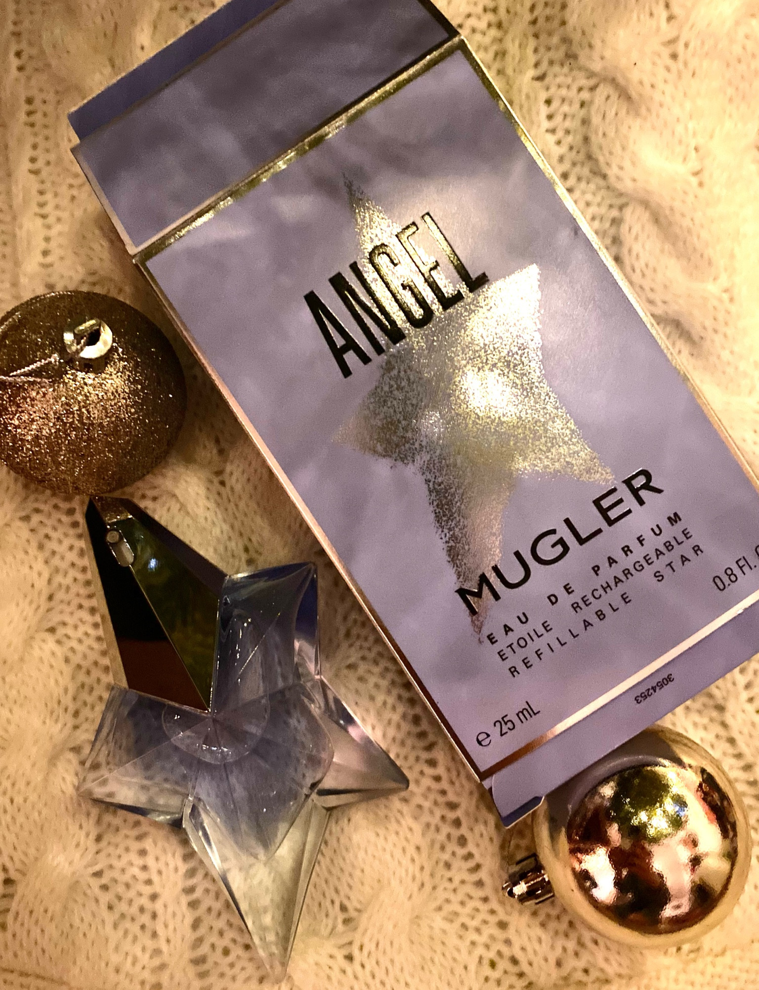 I was introduced to Angel fragrance at the age of 10 at a department store while visiting NYC for the first time.  I carried the paper with the sample spray on it the entire trip. My dad surprised me with it for Christmas that year and it was the perfect gift. The scent is woodsy with a hint of cherry and vanilla. To me it just smells like Christmas. My sweet sister in law (sister in love) gifted this to me this year 🤍

#LTKHoliday #LTKGiftGuide