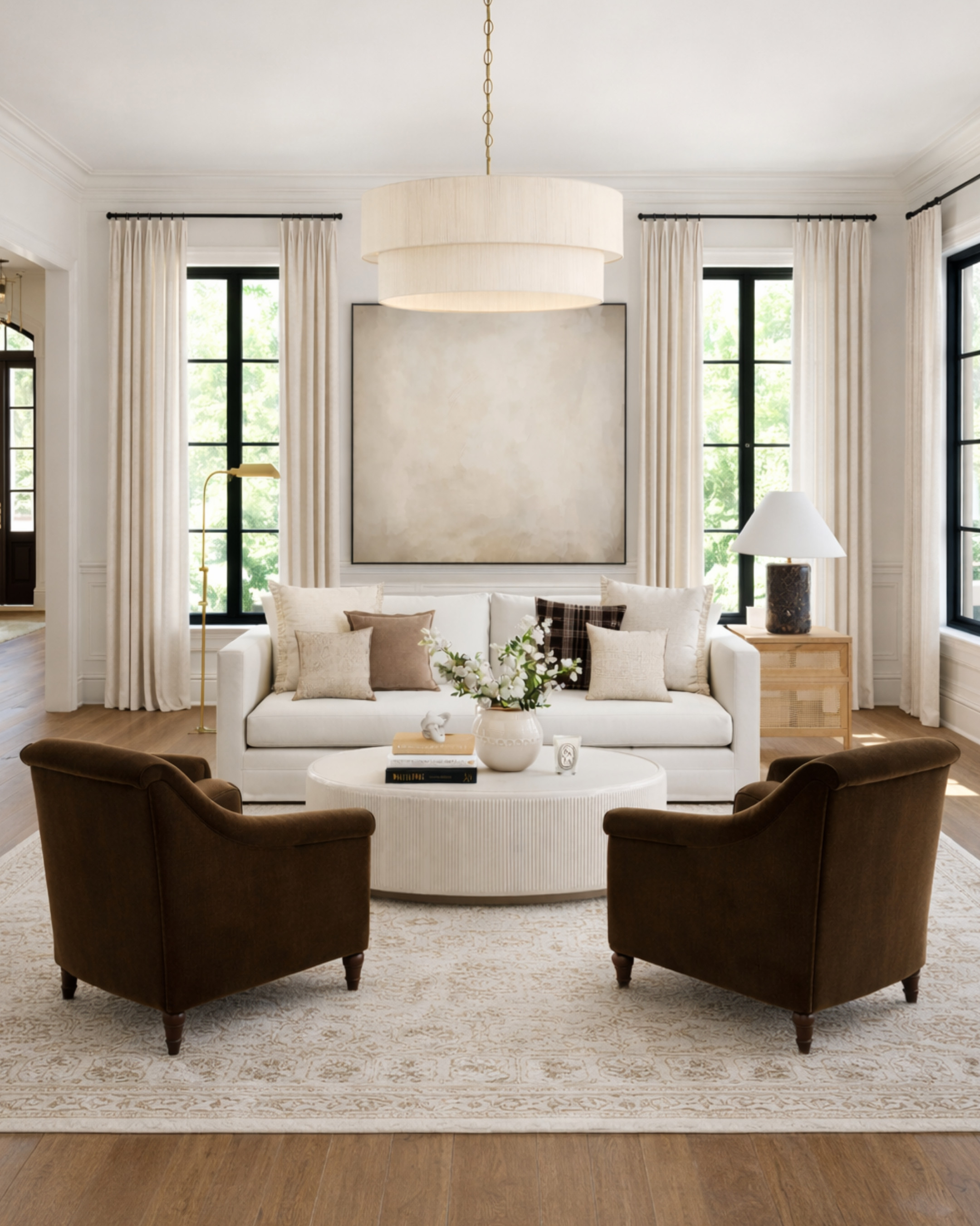 This is your sign that warm neutrals don’t have to feel boring. 🤍🤎 What makes this space work: • Layered neutrals instead of one flat beige (ivory, oat, camel, espresso) • A sculptural coffee table to break up all the soft upholstery • Low, rounded seating that keeps the room conversational • Textured pillows doing the heavy lifting (no loud color needed) • Tall drapery + oversized art to quietly add drama • Warm wood + brass accents so it feels collected, not showroom-y Designer tip: when everything is neutral, shape + texture matter more than color. That’s what makes a room feel finished instead of bland. All pieces linked to recreate the look 👇 Save this if you love cozy, elevated living rooms that actually feel livable. 

 #LTKHome