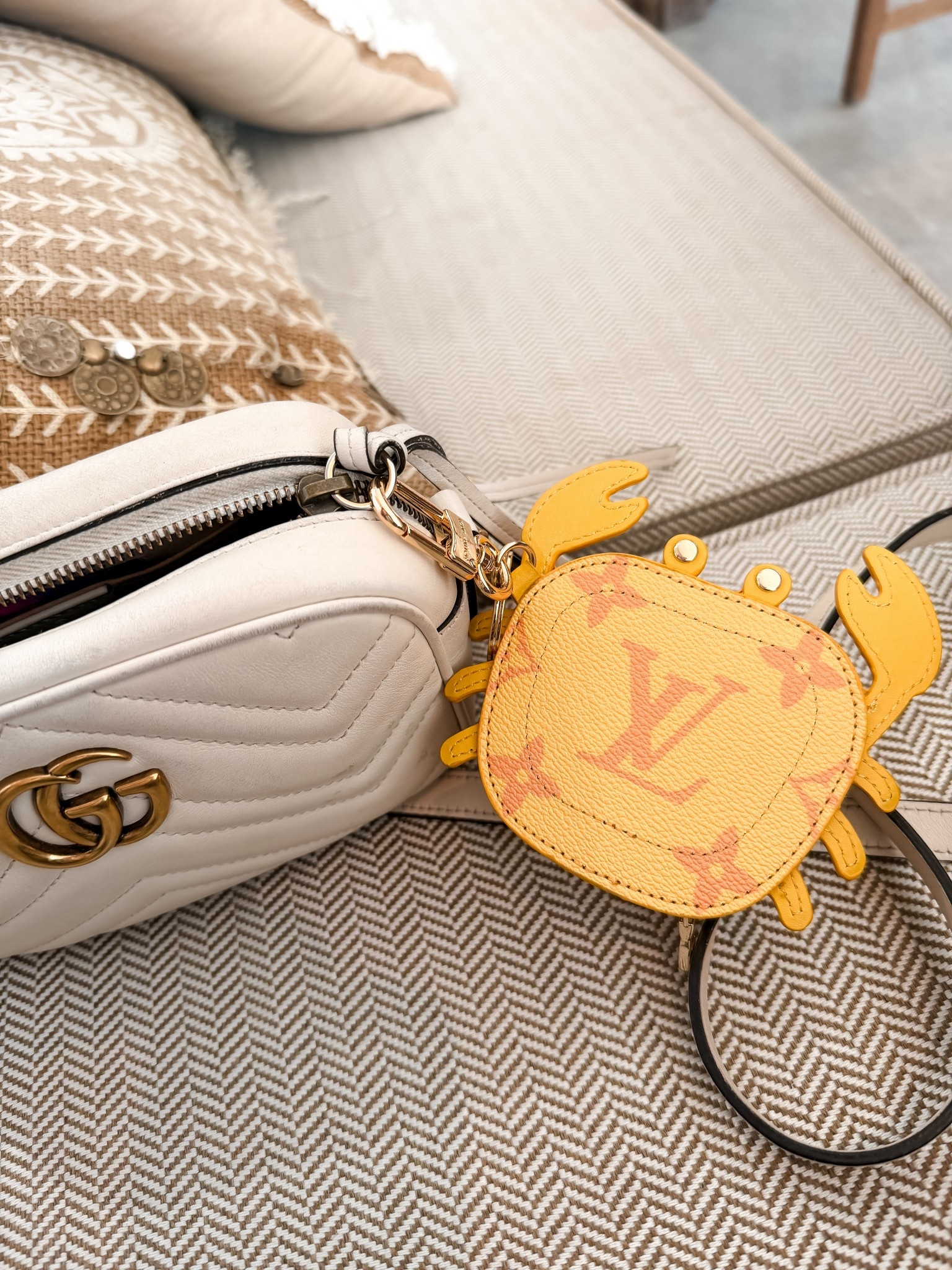 White Gucci Marmont camera bag is the perfect summer bag, Louis Vuitton crab coin purse for summer