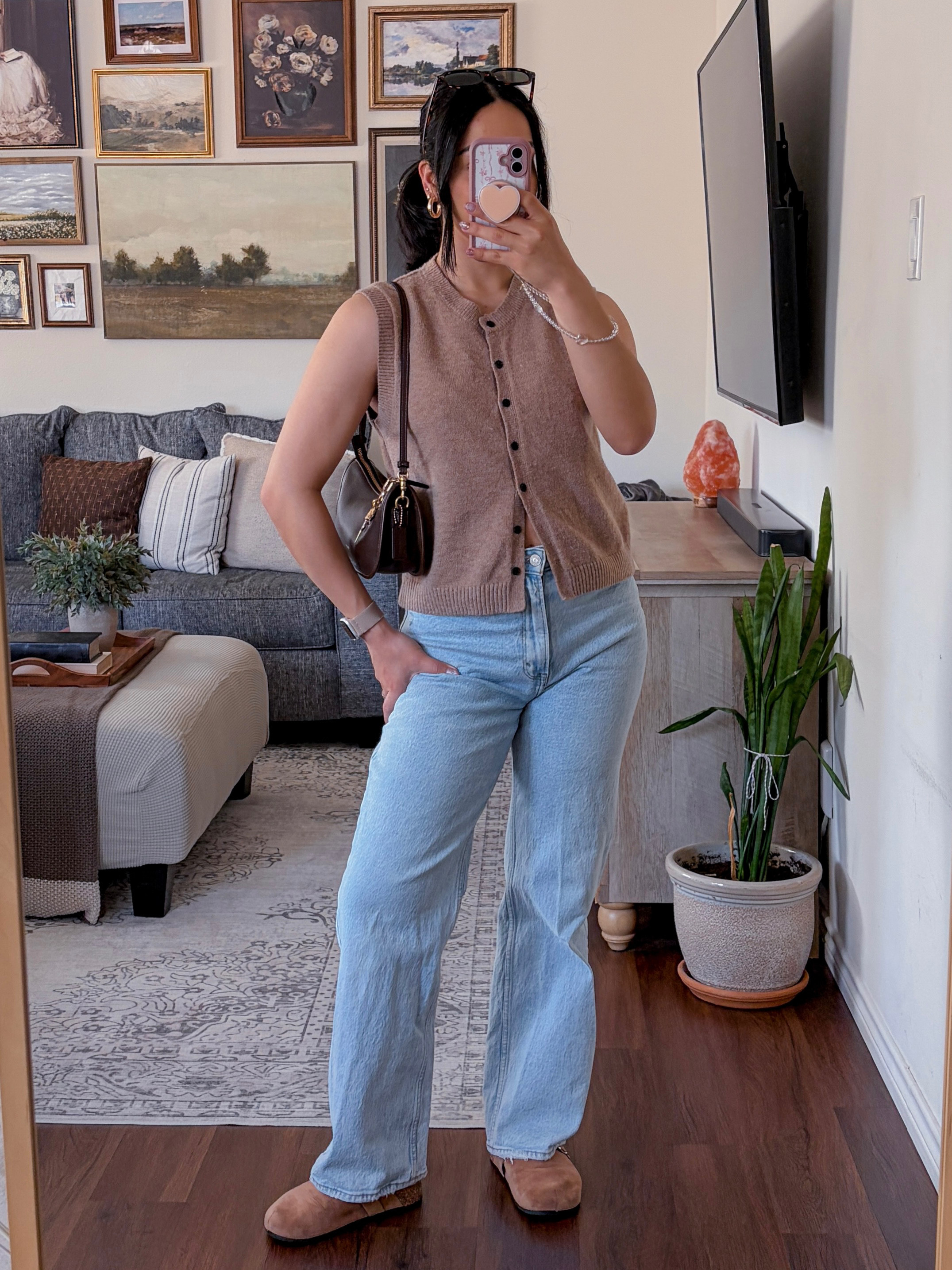 today's ootd 🫶🏼 casual laidback outfit, sleeveless sweater vest outfit, sweater vest styling, light wash jeans outfit, relaxed fit jeans outfit, everyday casual outfit, effortless casual style, neutral outfit inspo, abercrombie jeans outfit, abercrombie relaxed jeans, sweater vest top outfit, birkenstock style slip on shoes, brown coach shoulder bag outfit, coach bag styling, casual denim outfit ideas, brown shoulder bag outfit, tortoiseshell sunglasses outfit, trendy sunglasses styling, minimalist accessories, everyday bag outfit, neutral accessories outfit, laid back chic, effortless everyday style, pinterest inspired outfit, cool girl casual, minimalist casual outfit, comfy but put together, relaxed weekend outfit, casual outfit inspo pinterest, neutral outfit board, everyday outfit ideas, simple outfit formula, fashion mirror selfie  

 #LTKNYFW #LTKgrwm #LTKootd