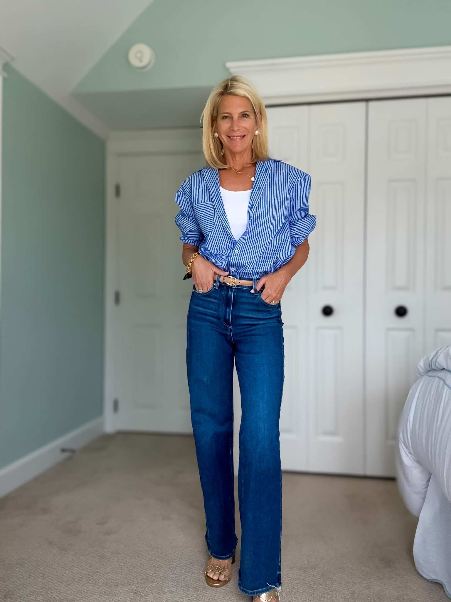 Classic blue striped button-down styled with dark wash jeans for an effortless casual chic outfit. 

 #LTKootd #LTKSeasonal #LTKOver40