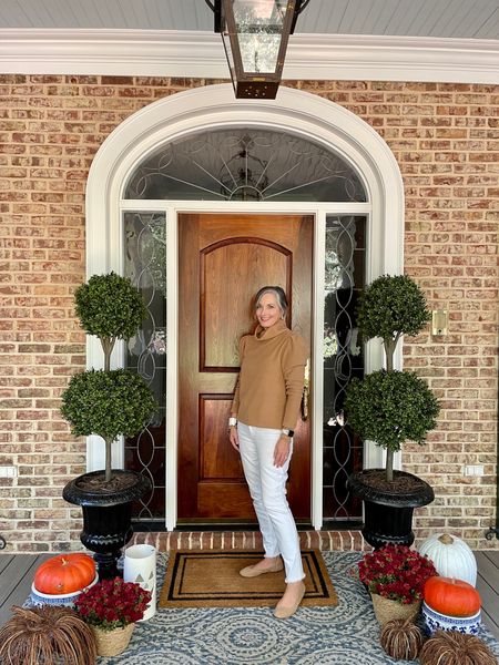 Nothing beats this cozy camel colored fleece turtleneck from Dudley Stephens! Get the look with my faux topiaries for our fall front porch! My flats from Amazon are so comfy! I have them in 3 colors. 

#LTKSeasonal #LTKhome #LTKstyletip