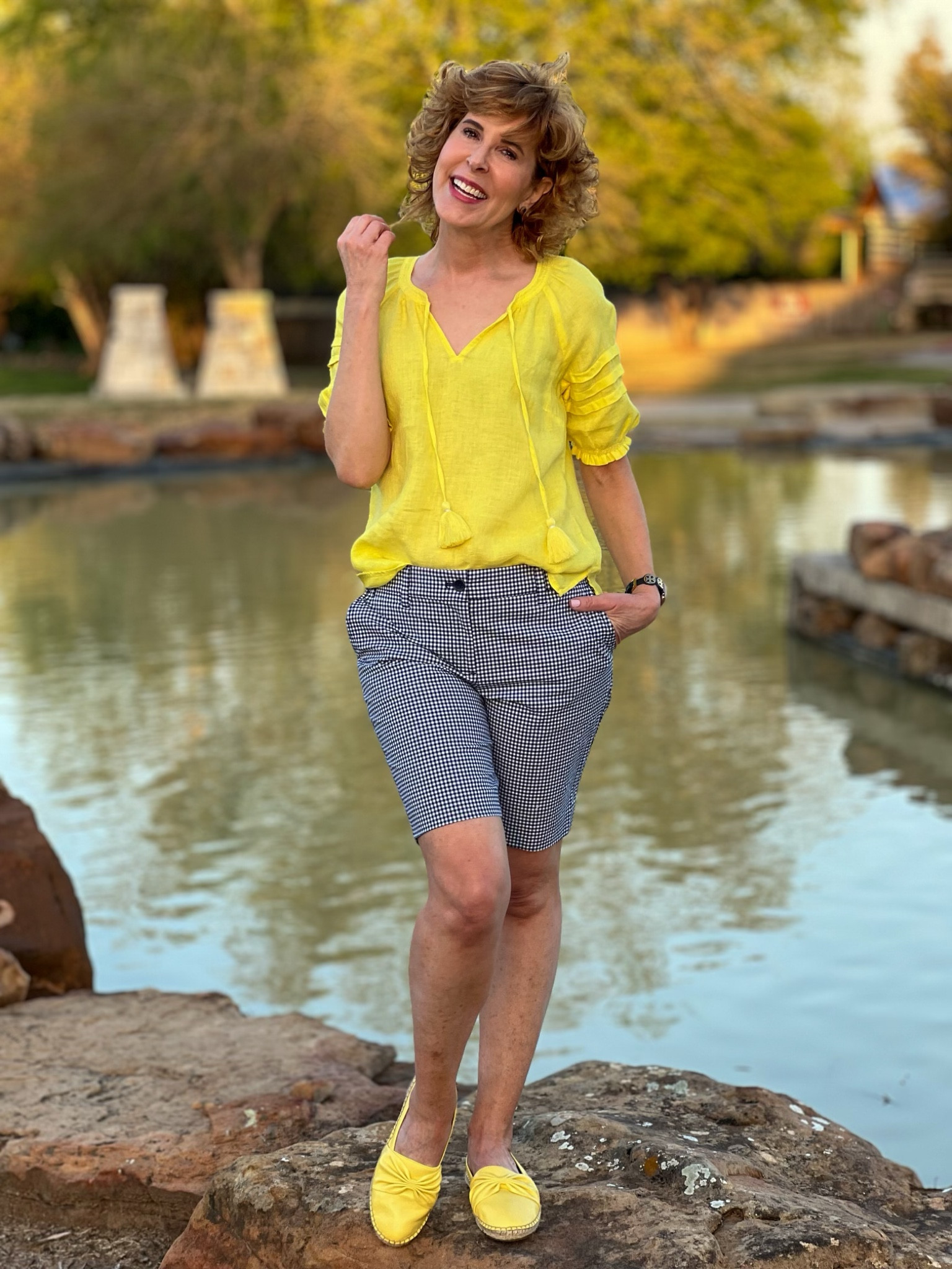 This breezy linen top has pleated sleeve details with the cutest ruffle cuffs. I love the tassel ties at the neck and the flattering V-neckline. I paired it with a darling pair of 10.5" gingham shorts. The long length makes them so versatile - you can pair them with sneakers, sandals, or wedges - but the gingham makes them playful and fun.
I paired them with yellow leather espadrilles that (unlike most espadrilles), have a flexible outsole and a memory foam insole!


#LTKshoecrush #LTKstyletip #LTKSeasonal