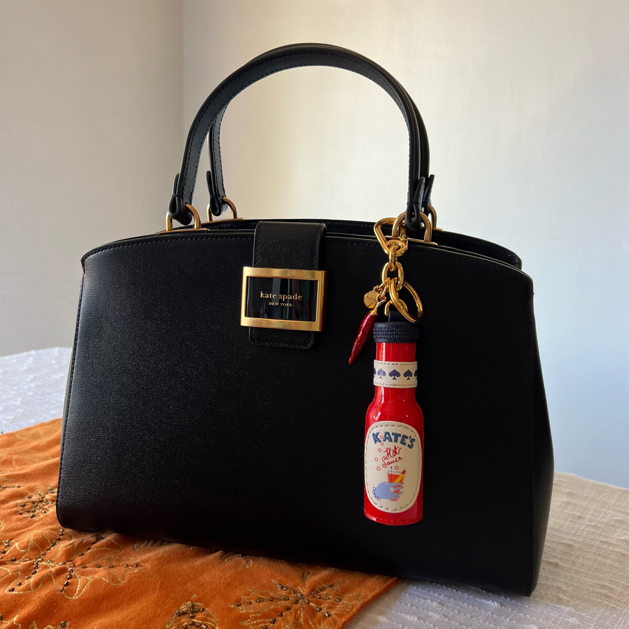 The bag I’ve always wanted 😍 mine is the Katy Satchel. I could only find the deep cherry color online but it’s a gorgeous color! The hot sauce bottle’s charm is sold out unfortunately :(

#bagcharm #katespade

#LTKItBag #LTKGiftGuide #LTKStyleTip