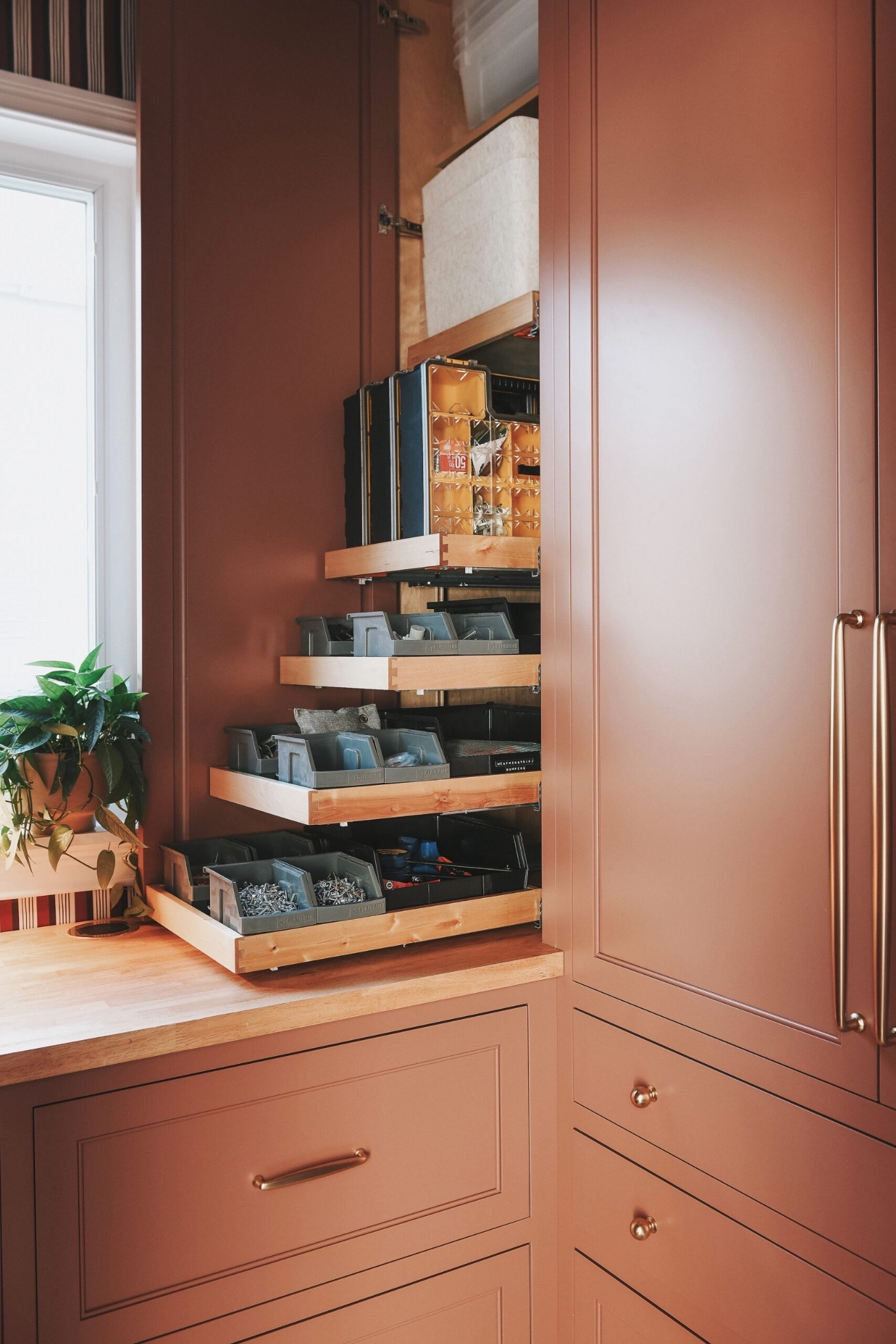 A dozen small bins that hold our fasteners, cutting tools and miscellaneous “keeper" spare parts now live in a series of pullout sliders that bring them into perfect view for easy access

#LTKHome