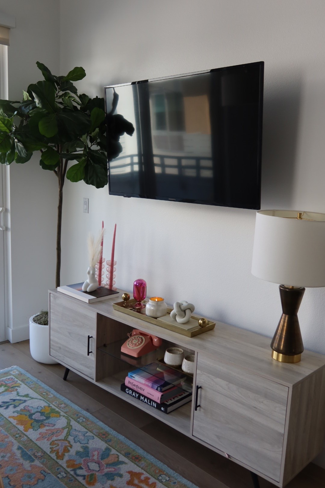 Tv console 💖 The key to cute decor? The knick knacks! The plant is fake (bc I can’t do real) but it looks SO nice and not plastic at all. I get so many compliments! 

#LTKHome #LTKFindsUnder50 #LTKFindsUnder100