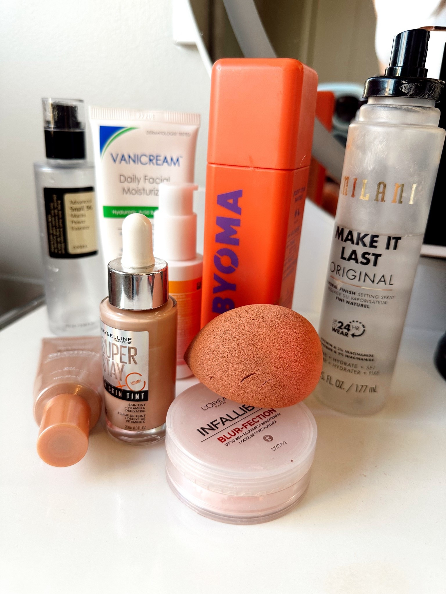 My everyday drugstore base that lasts, looks so good, great for sensitive skin and is super affordable! Order goes like this snail mucin, everyday moisturizer, sunscreen, milky toner, Loreal Glotion, maybelline skin tint, spray it all down with Milani make it last, blend with a beauty blender and set everything with infallible powder! #everydaymakeup #drugstoremakeup #affordablemakeup #skincare #makeupover35 

#LTKFindsUnder50 #LTKgrwm #LTKBeauty